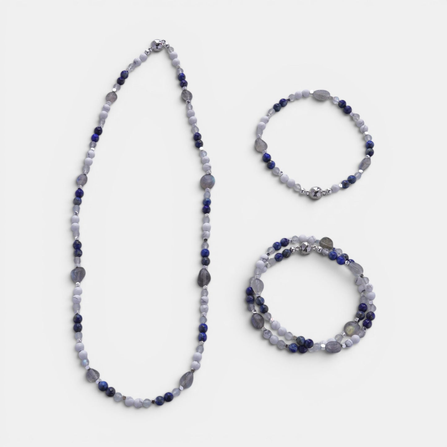 Hollywood Road Stories beaded gemstone necklace and stretch bracelets with blue sodalite, white howlite, and moonstone.