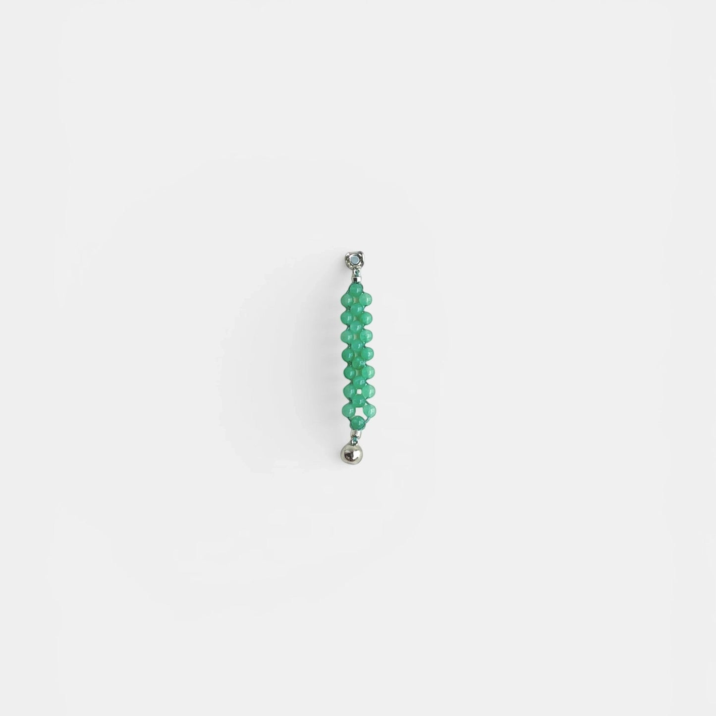 Hollywood Road Stories green beaded statement ring with silver-tone clasp on a white background.