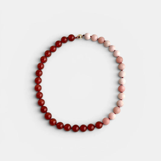 Hollywood Road Stories Hong Kong statement necklace with pink opal and red carnelian beads, smooth color-block design, sleek magnetic clasp.