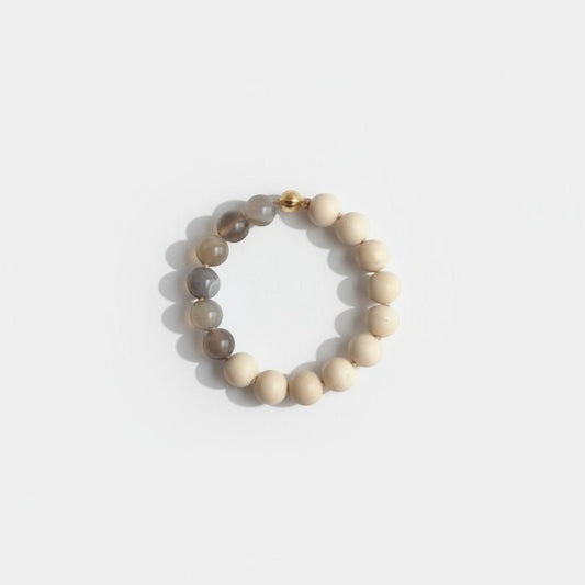 Hollywood Road Stories beaded bracelet with cream gemstones, natural agate, and a gold-tone magnetic clasp.