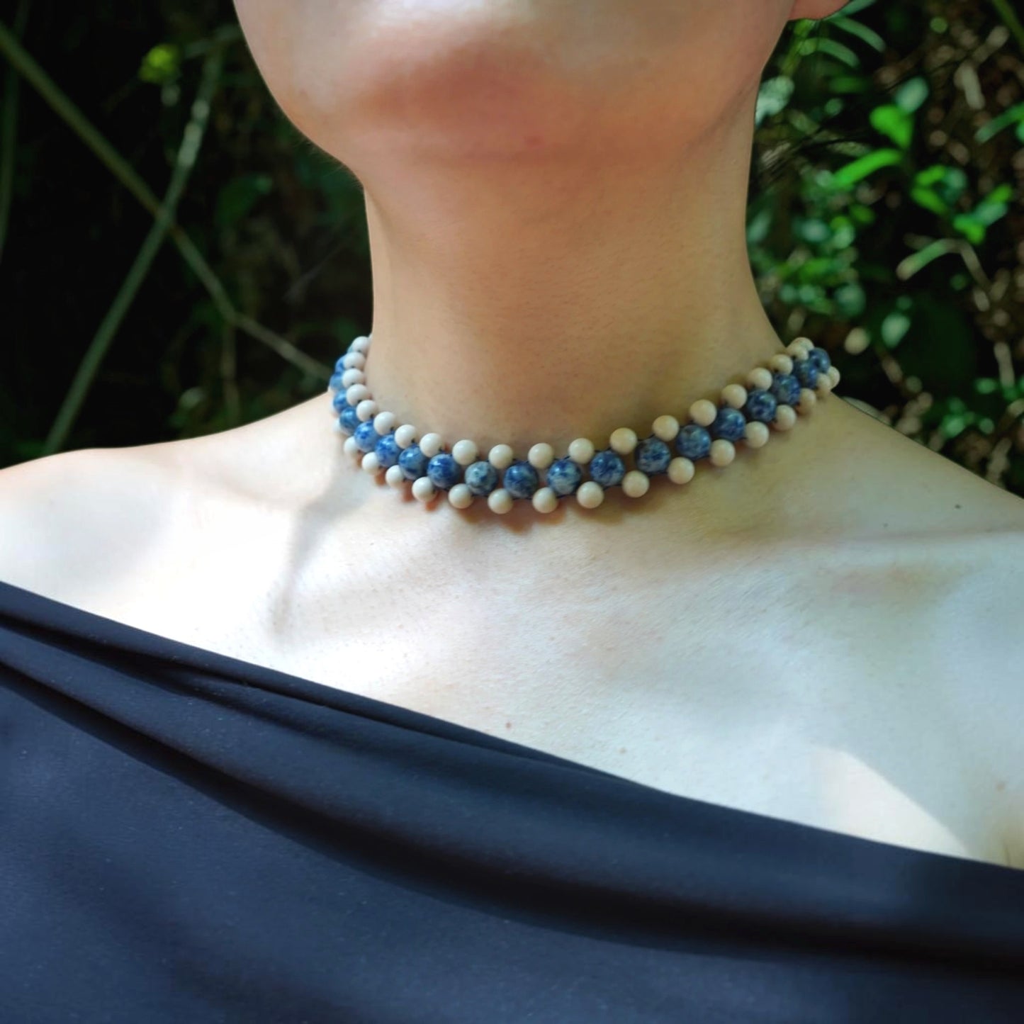 blue sodalite and jasper necklace worn over a strapless top, ideal for a 40th birthday gift.