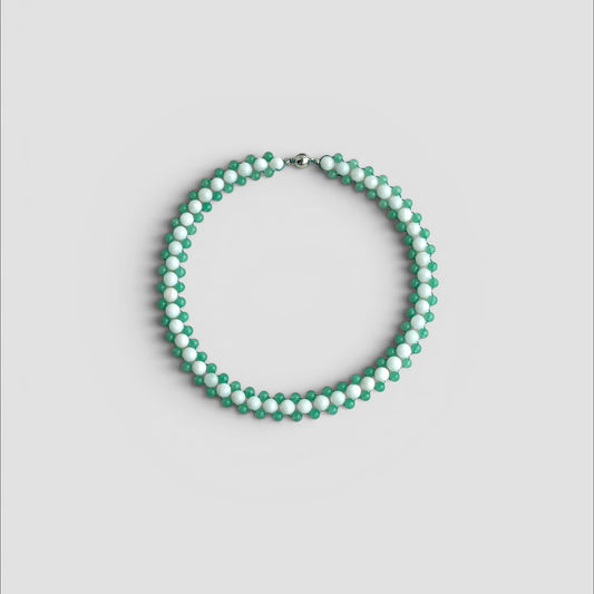 Hollywood Road Stories beaded choker necklace with alternating white and sage green beads in a woven pattern.