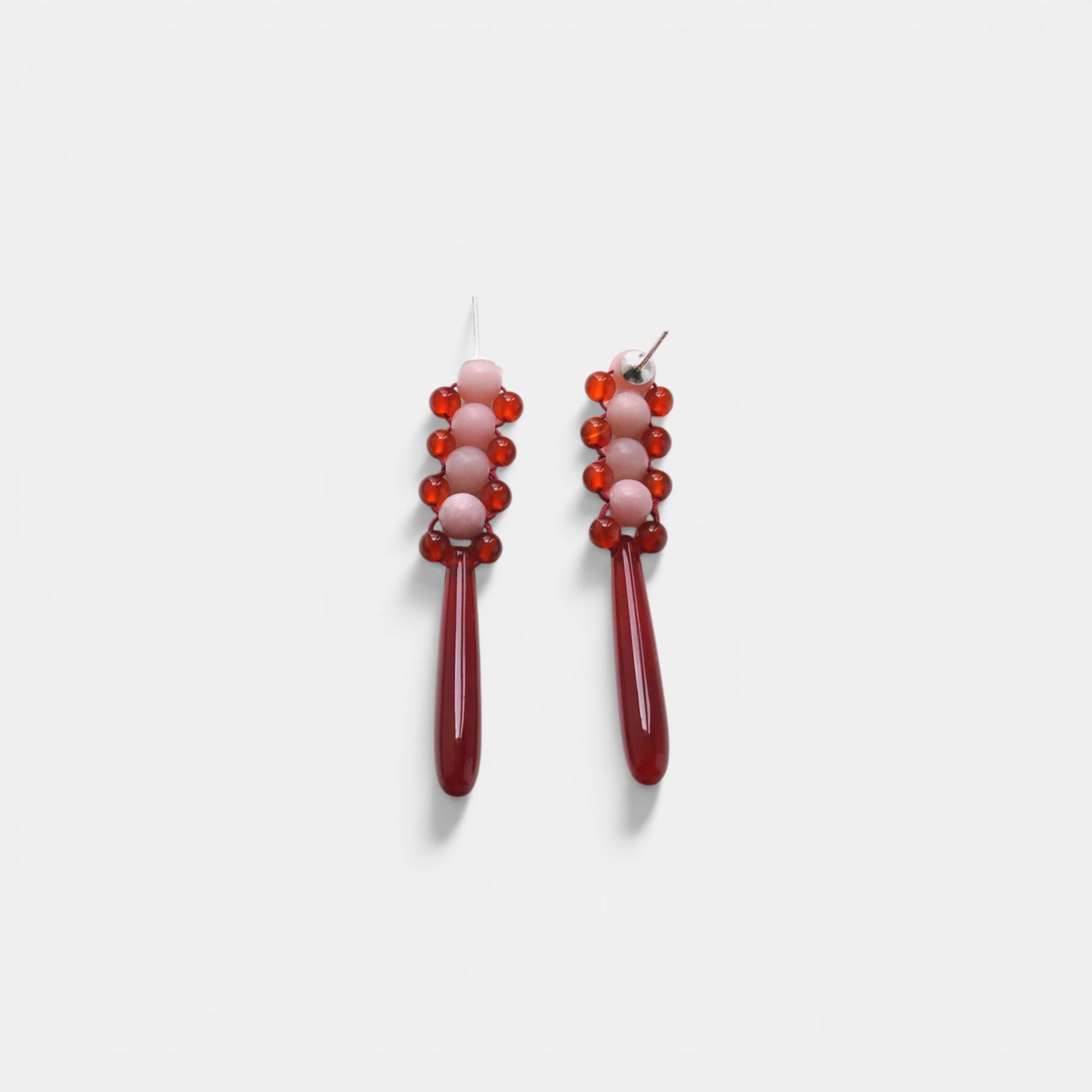 Hollywood Road Stories handcrafted drop earrings featuring pink and dark red beads with a sleek dangling design.