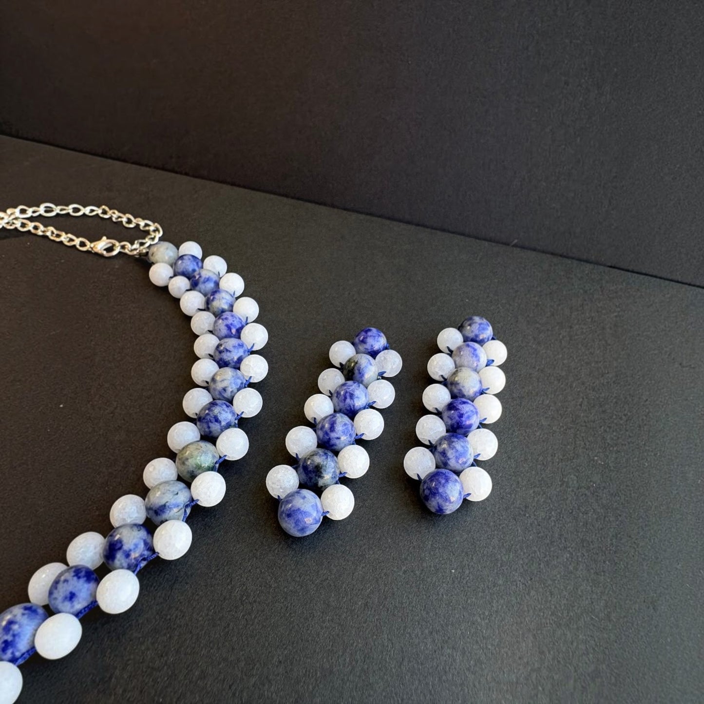 Hollywood Road Stories handcrafted beaded statement earrings and matching necklace in blue sodalite and white beads.