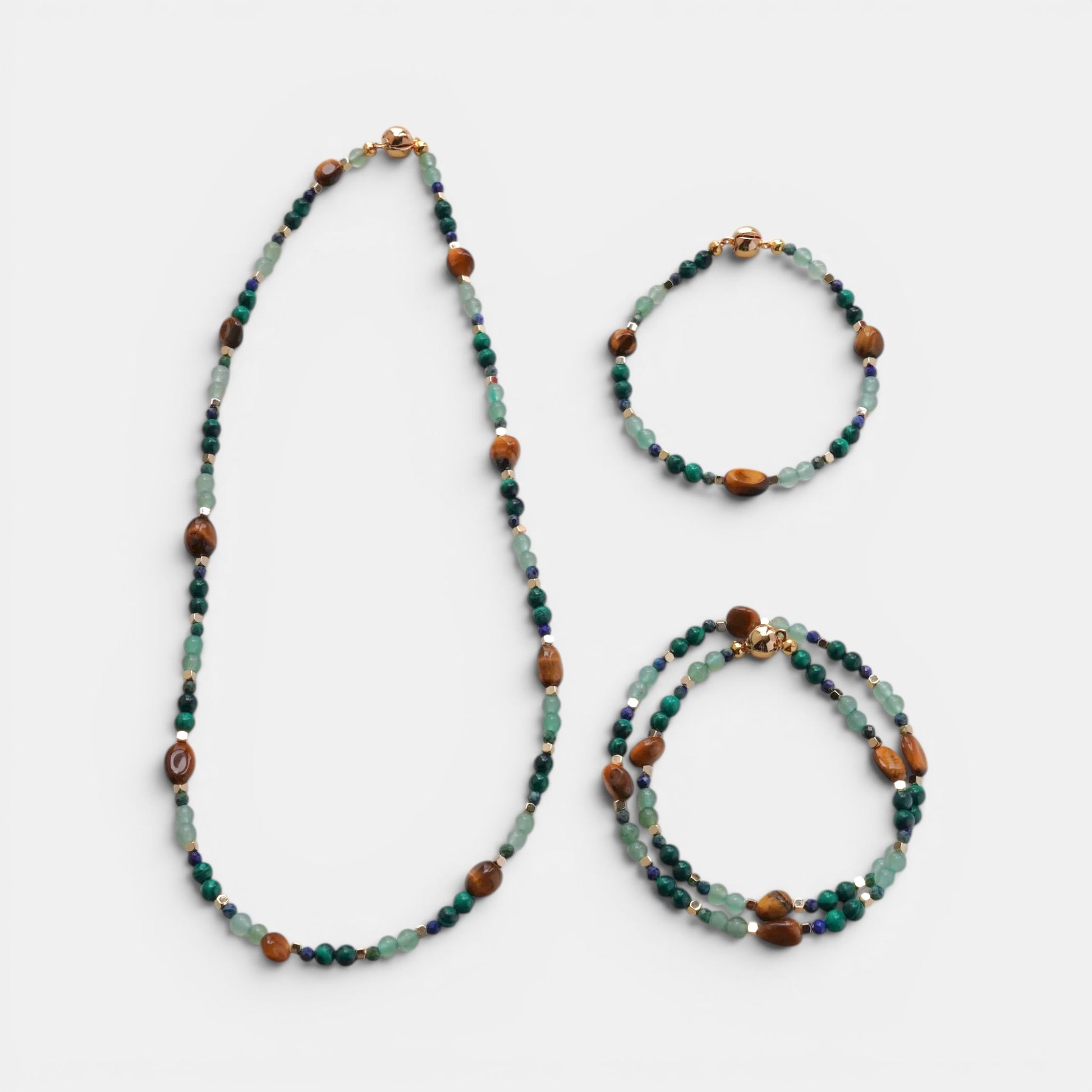 Hollywood Road Stories handcrafted jewelry set with tiger's eye, malachite, and jade beads with gold-tone magnetic clasps.