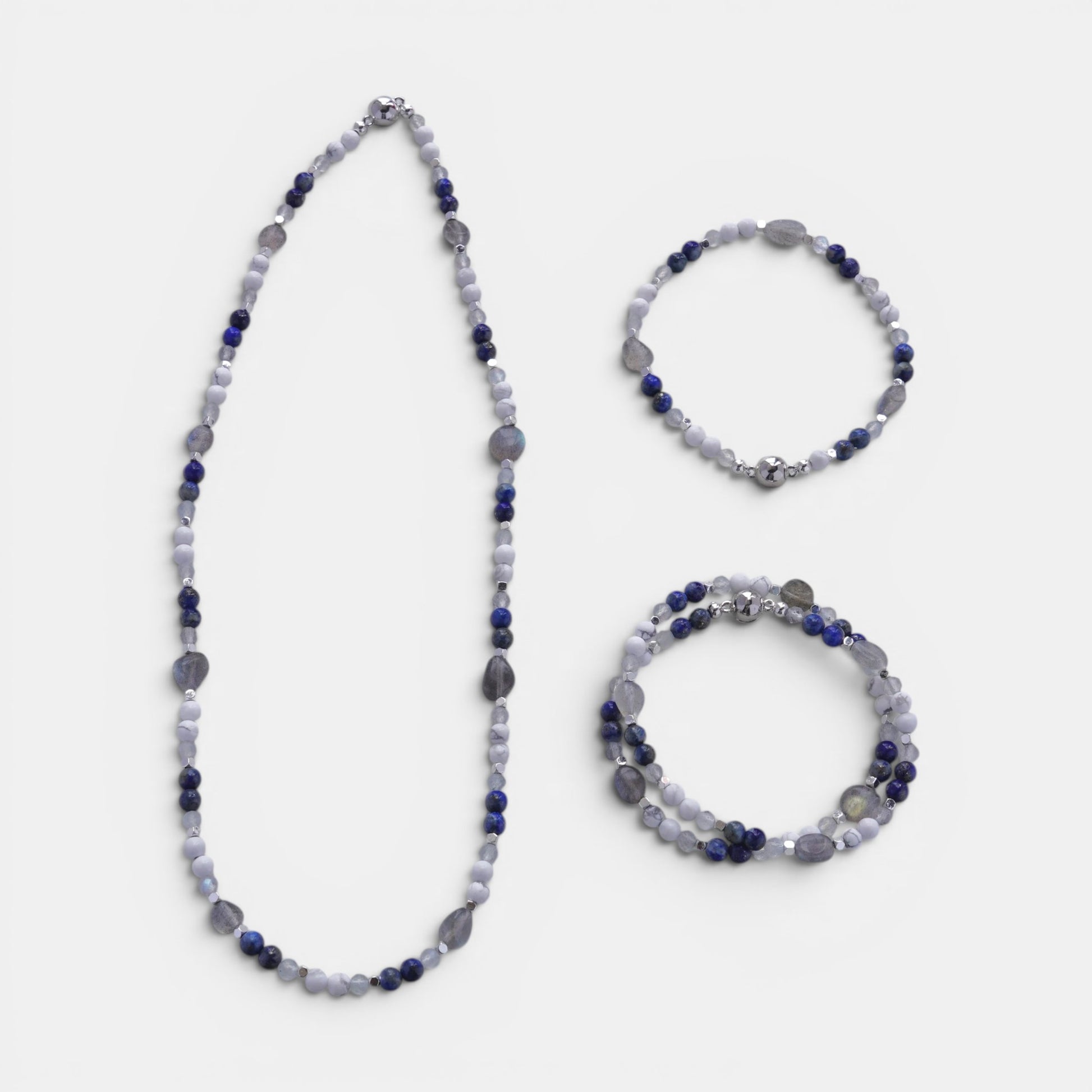 Hollywood Road Stories beaded gemstone necklace and stretch bracelets with blue sodalite, white howlite, and moonstone.