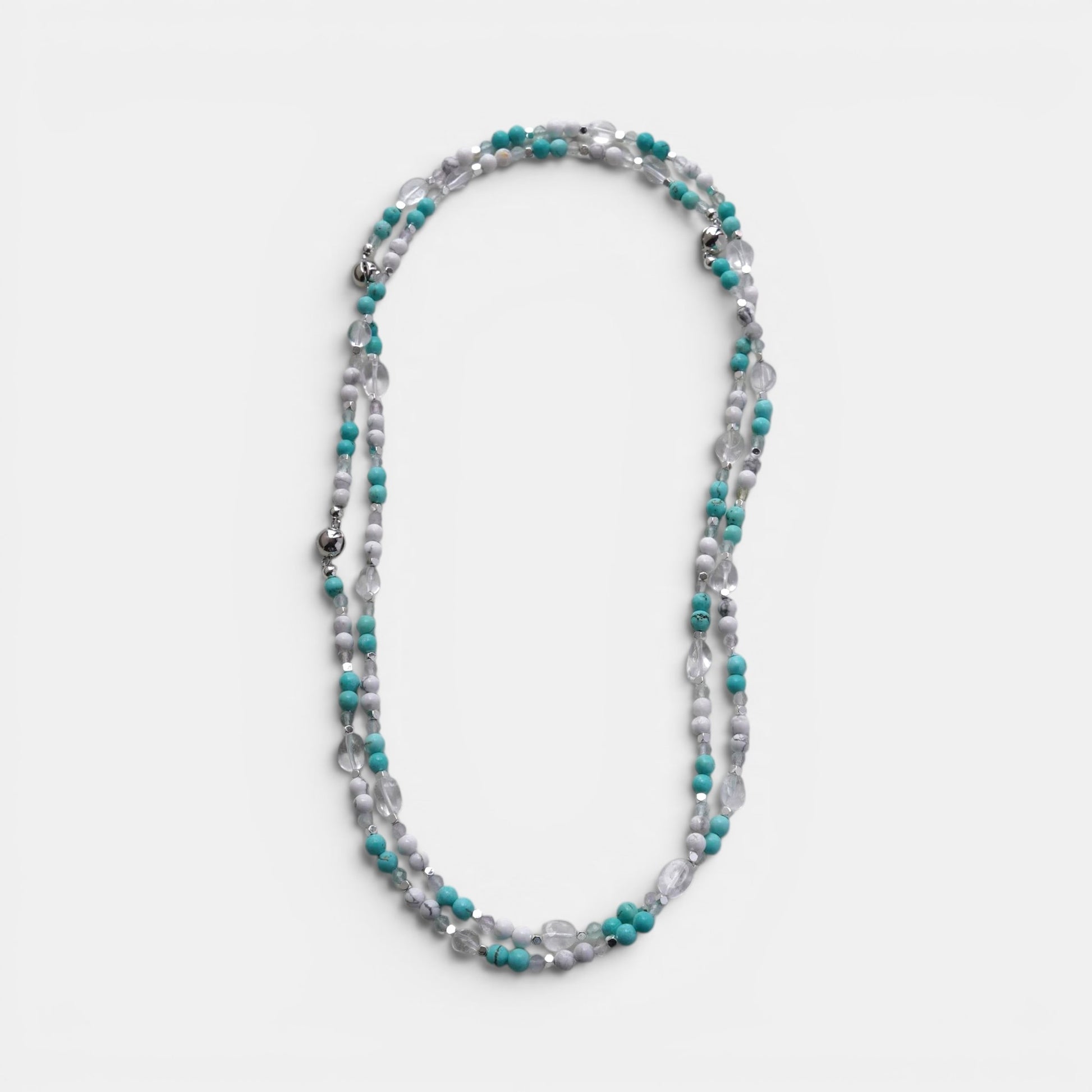 Hollywood Road Stories multi-strand beaded necklace with turquoise, white, and clear crystal beads and silver accents.