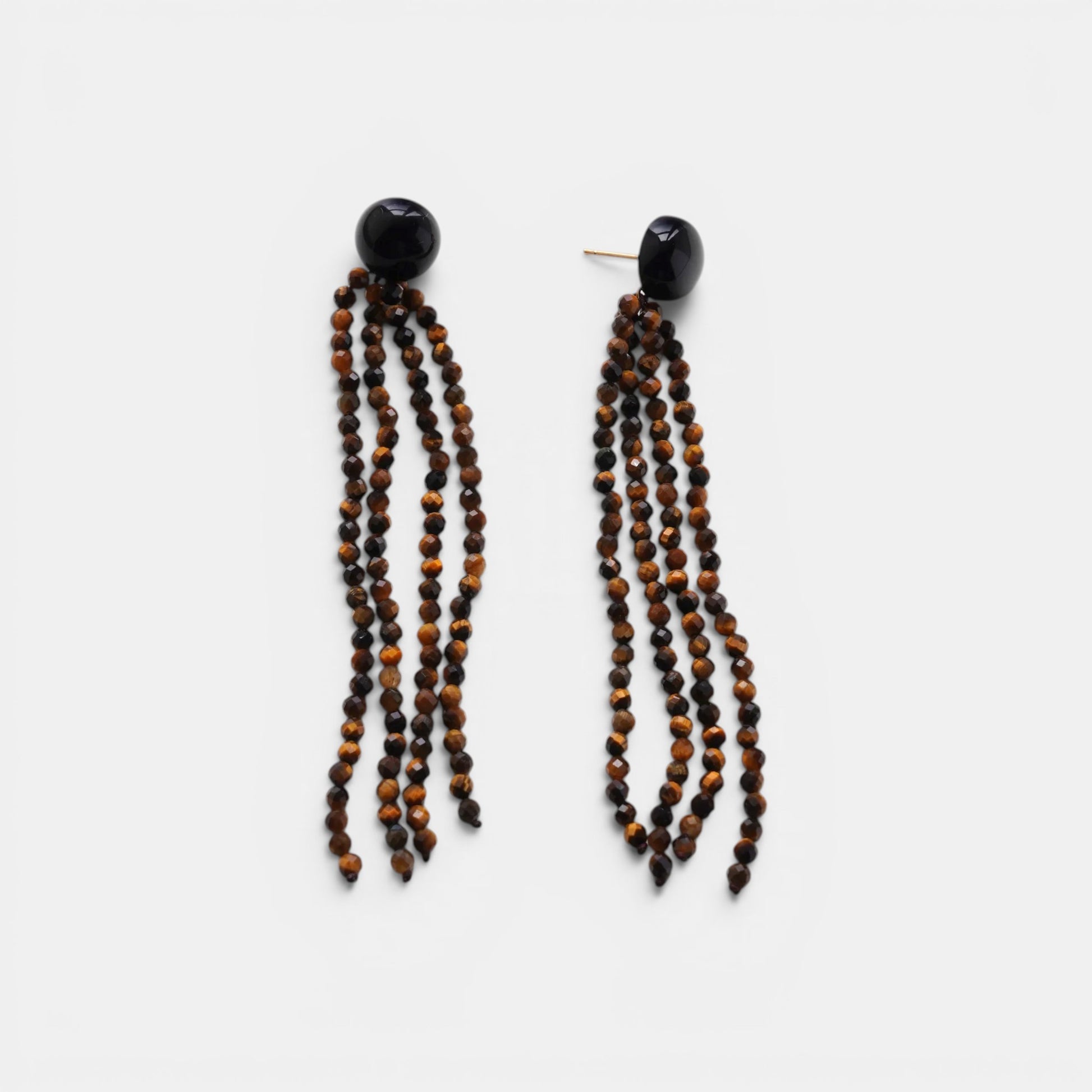 Hollywood Road Stories beaded tassel earrings featuring faceted tiger's eye strands and polished black onyx studs.