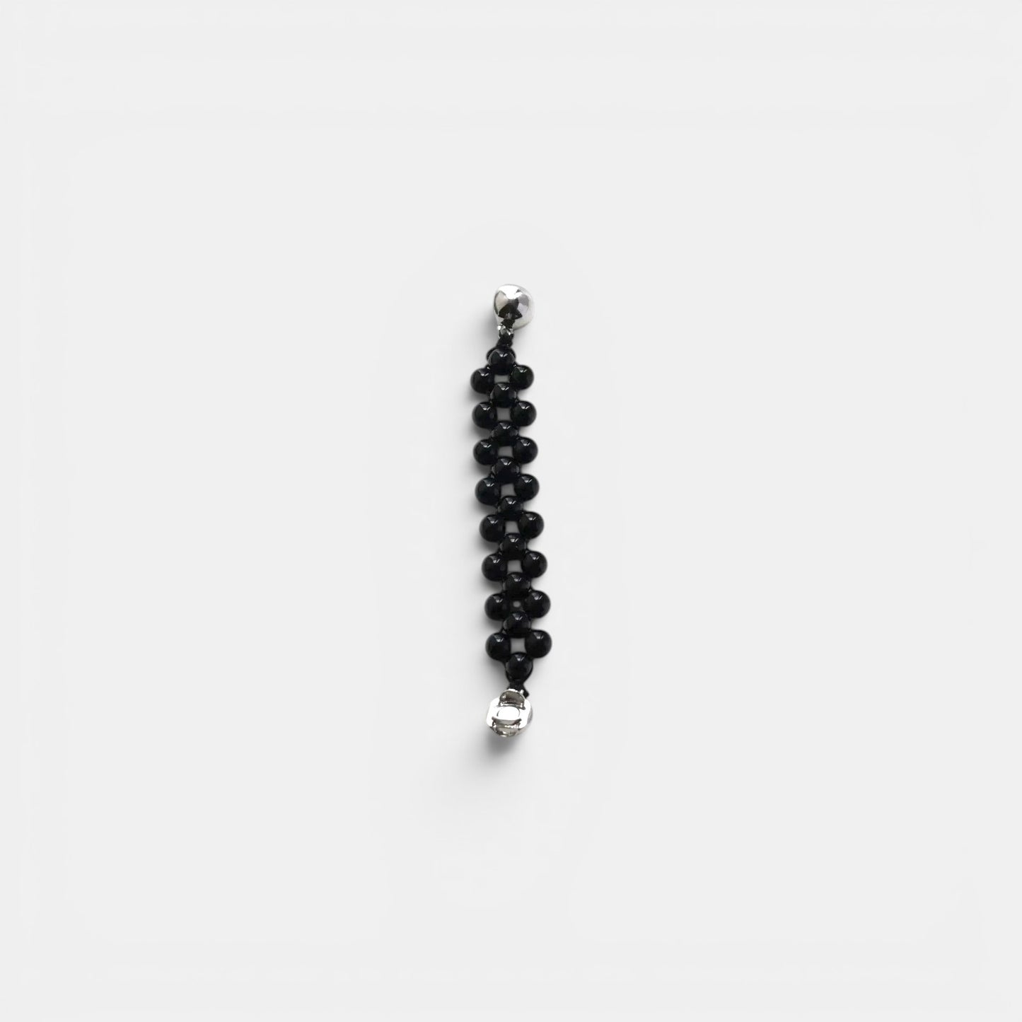 Hollywood Road Stories black beaded bracelet with multi-row woven design and polished silver-tone hardware.