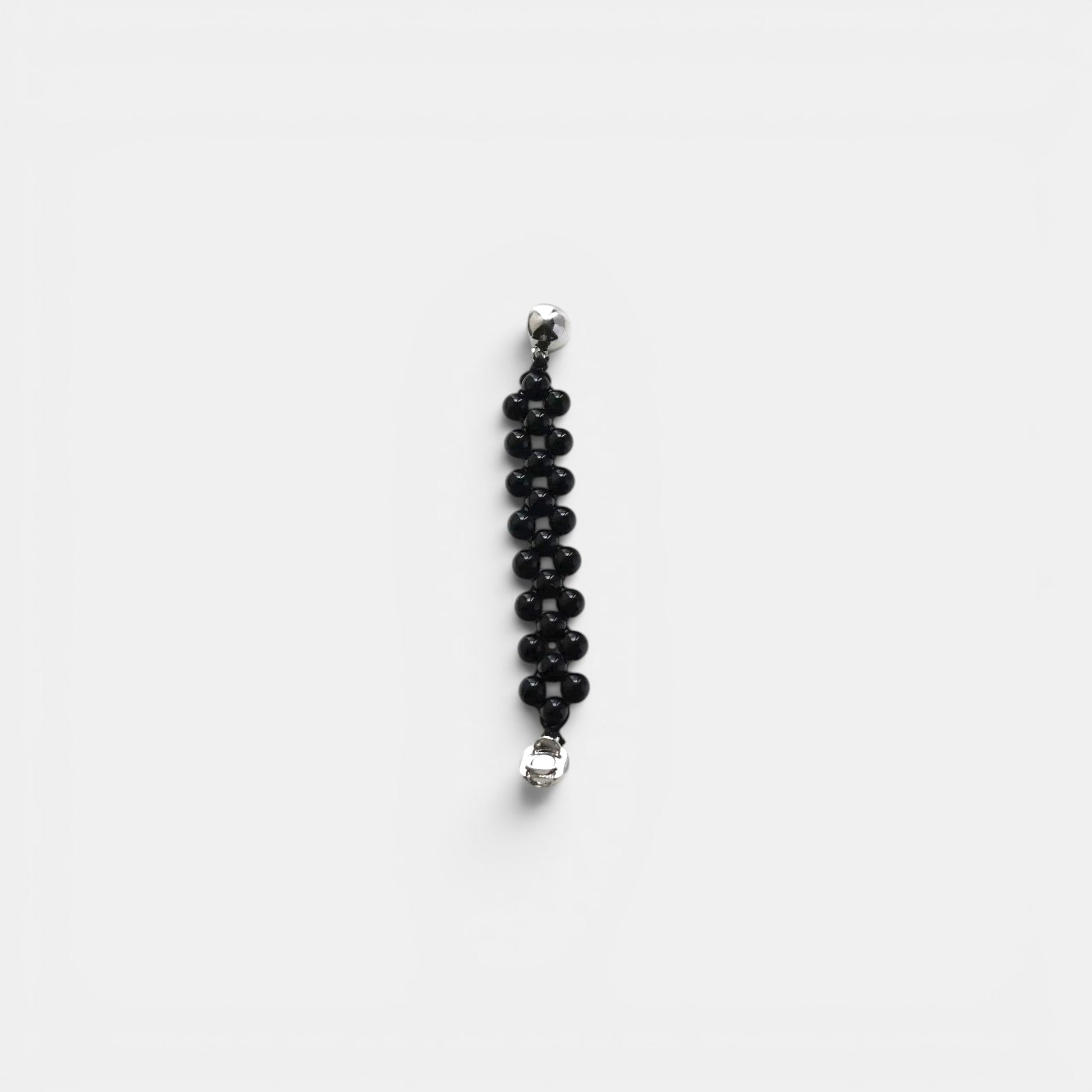 Hollywood Road Stories black beaded bracelet with multi-row woven design and polished silver-tone hardware.