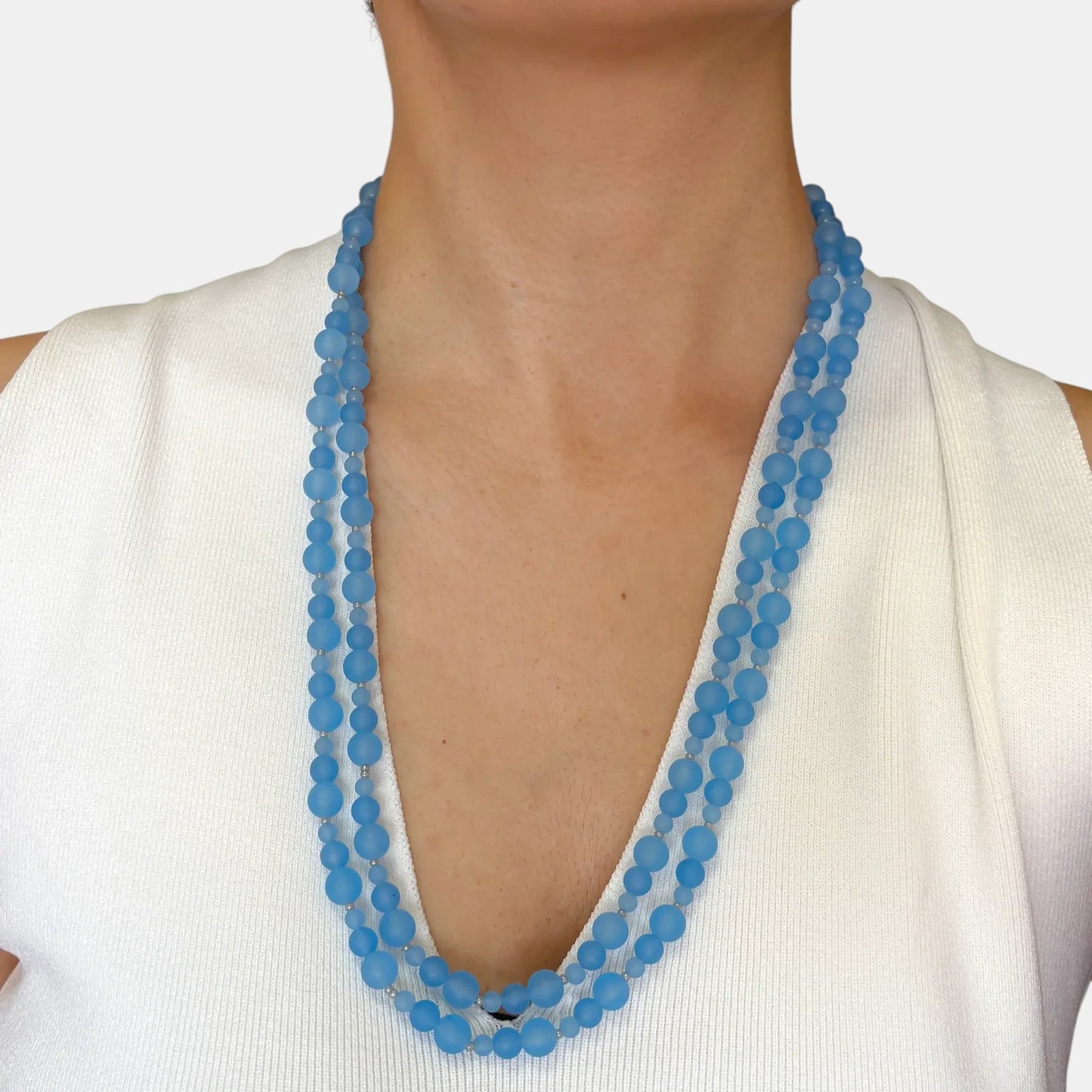 Hollywood Road Stories multi-strand necklace featuring slate blue chalcedony beads worn layered on a model.