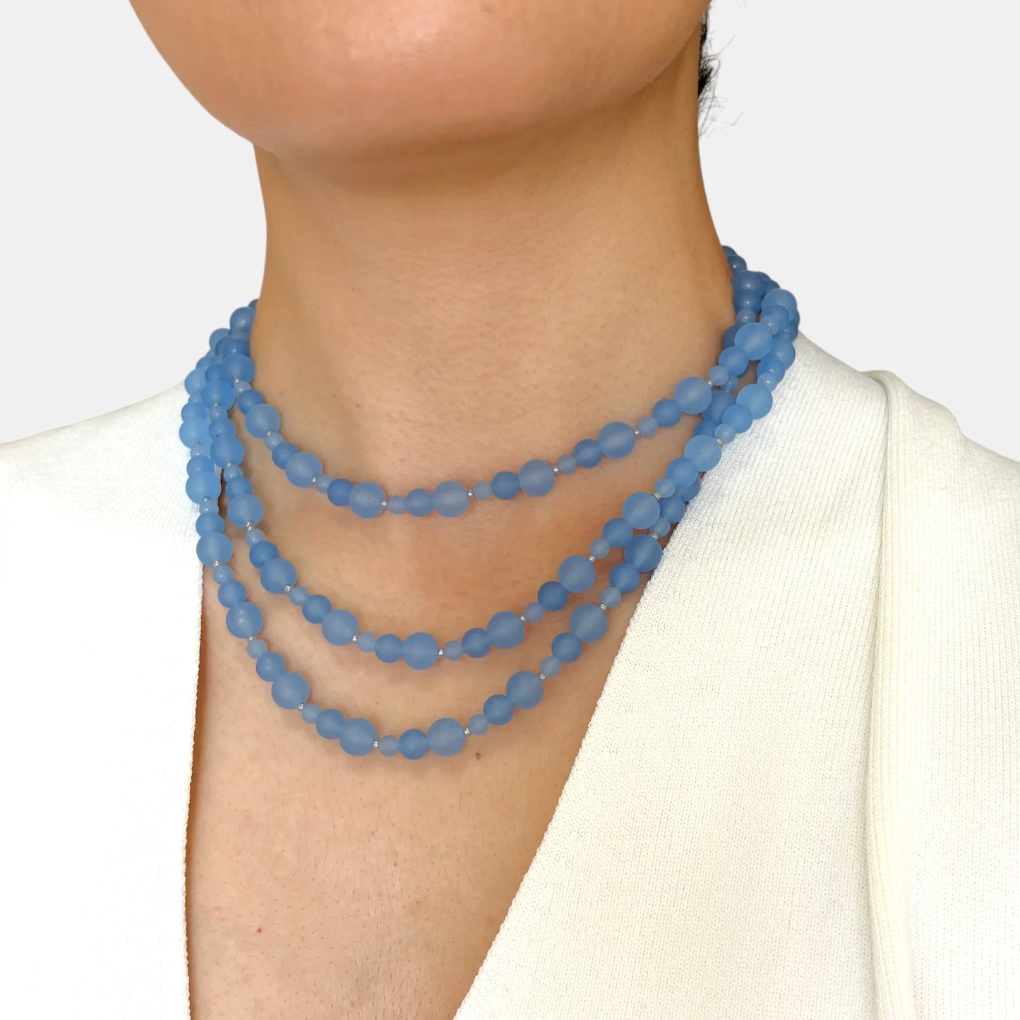 Hollywood Road Stories multi-strand slate blue chalcedony beaded necklace worn as a layered choker on a model