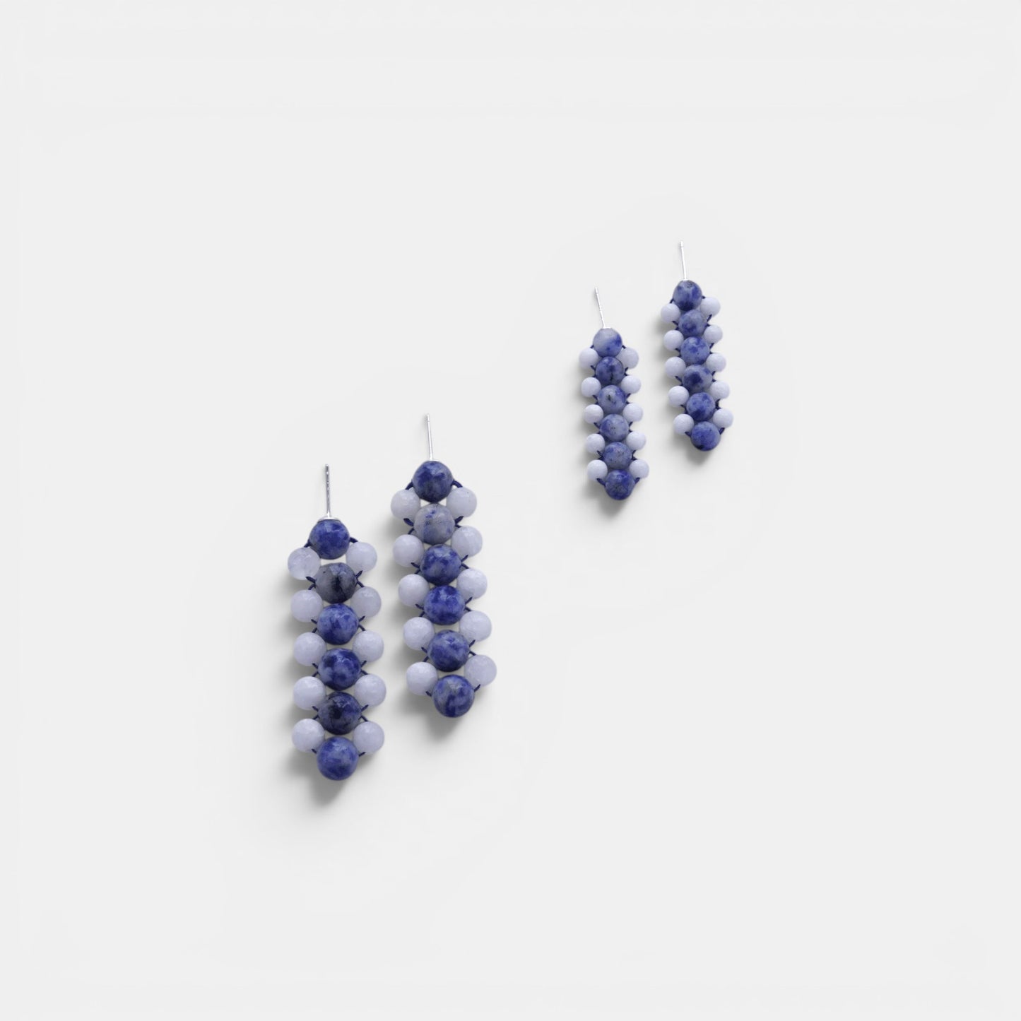 Hollywood Road Stories handcrafted statement earrings with blue marbled and matte white beads in a linear drop design.