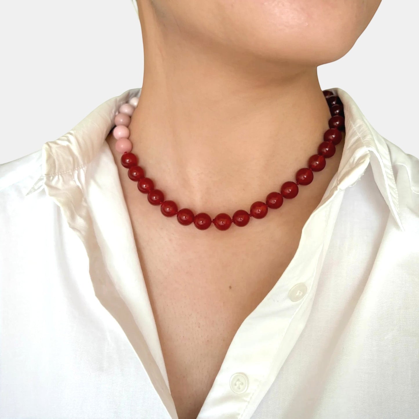 Hollywood Road Stories Bonham choker featuring pink opal and red carnelian beads worn with a white shirt