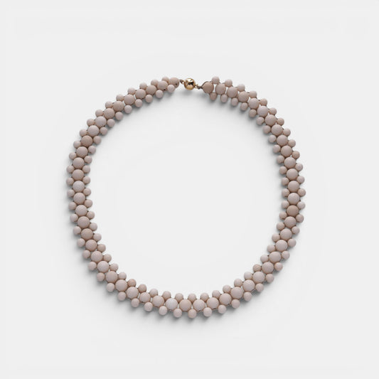 Hollywood Road Stories double strand cream beaded statement necklace with a polished gold-tone clasp.