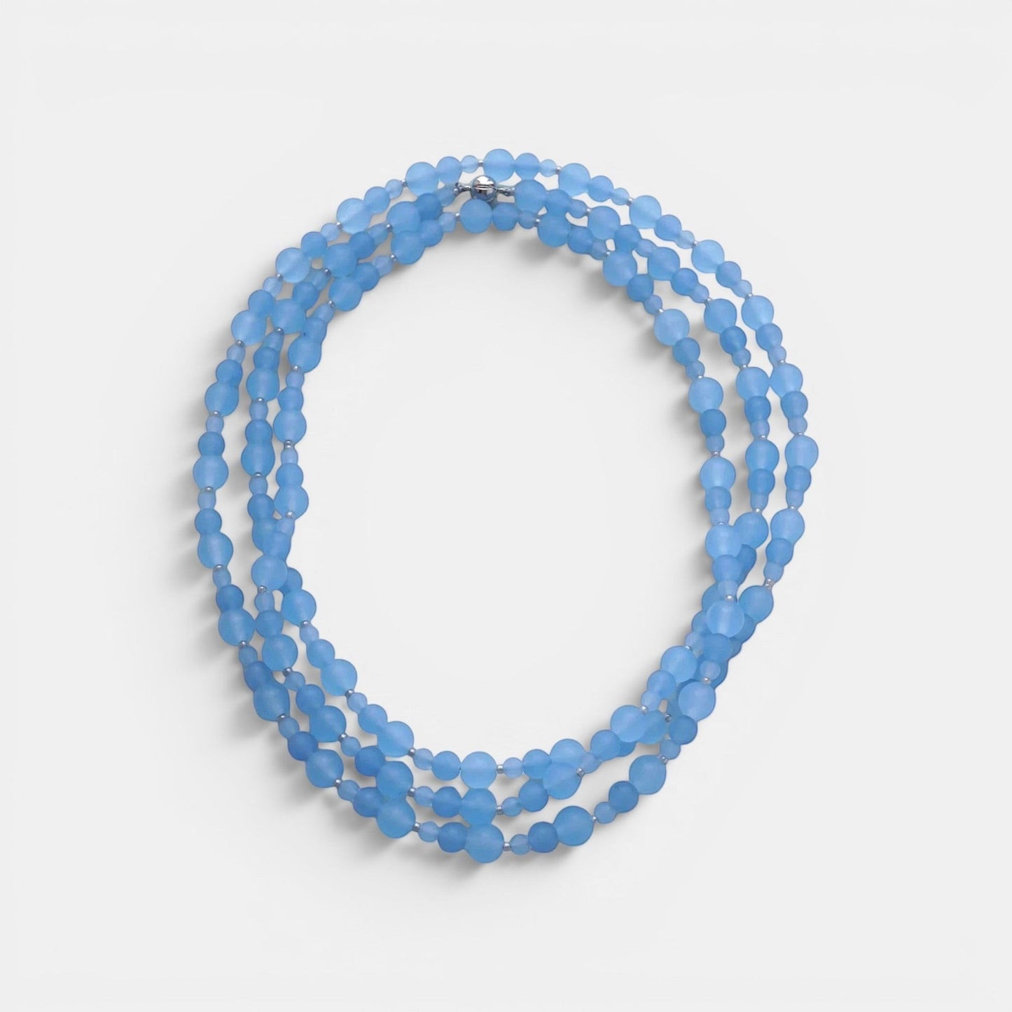 Hollywood Road Stories triple-strand frosted sky blue glass bead necklace with silver-toned spacers.