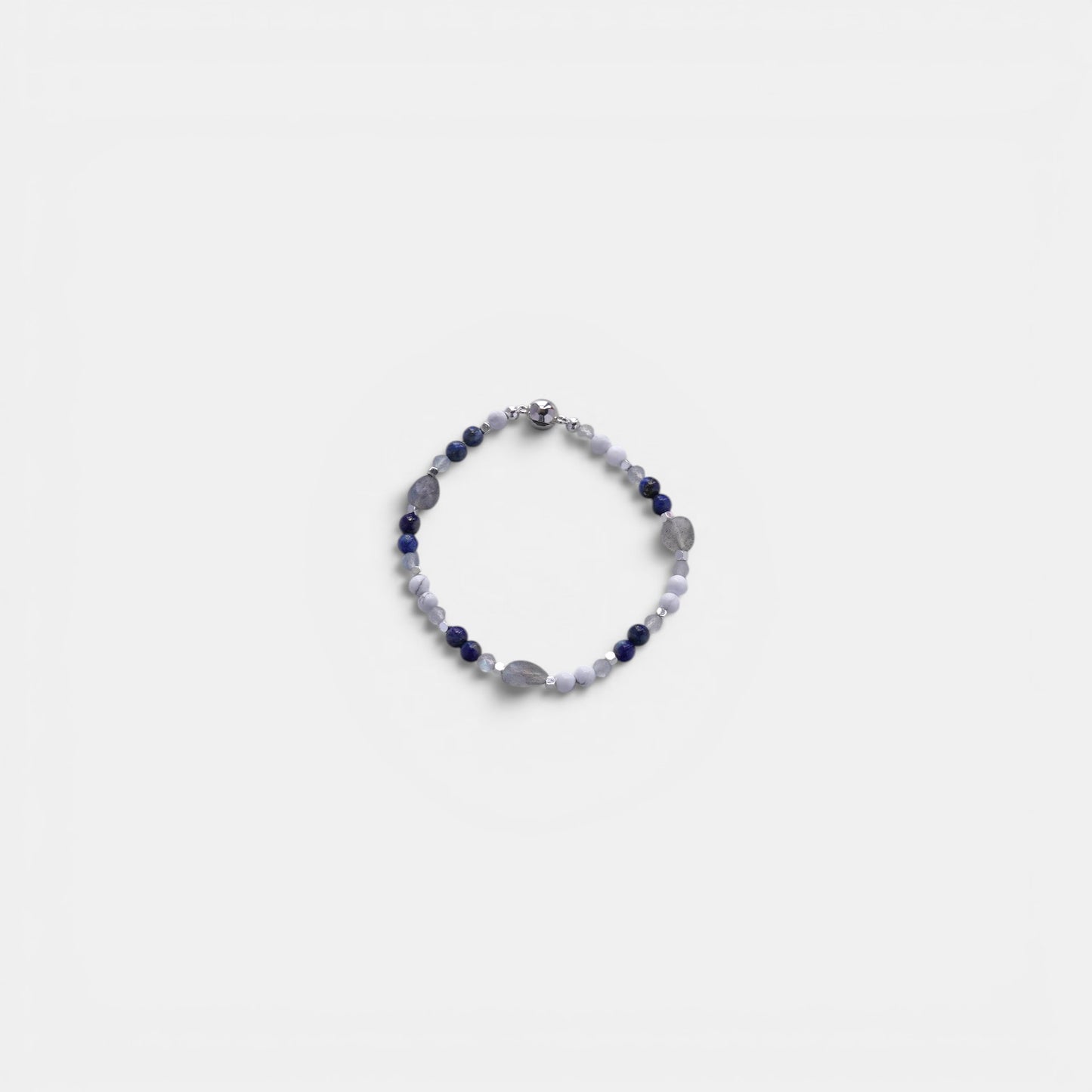 Hollywood Road Stories stretch bracelet featuring blue sodalite, white howlite, and grey moonstone beads with metallic accents.