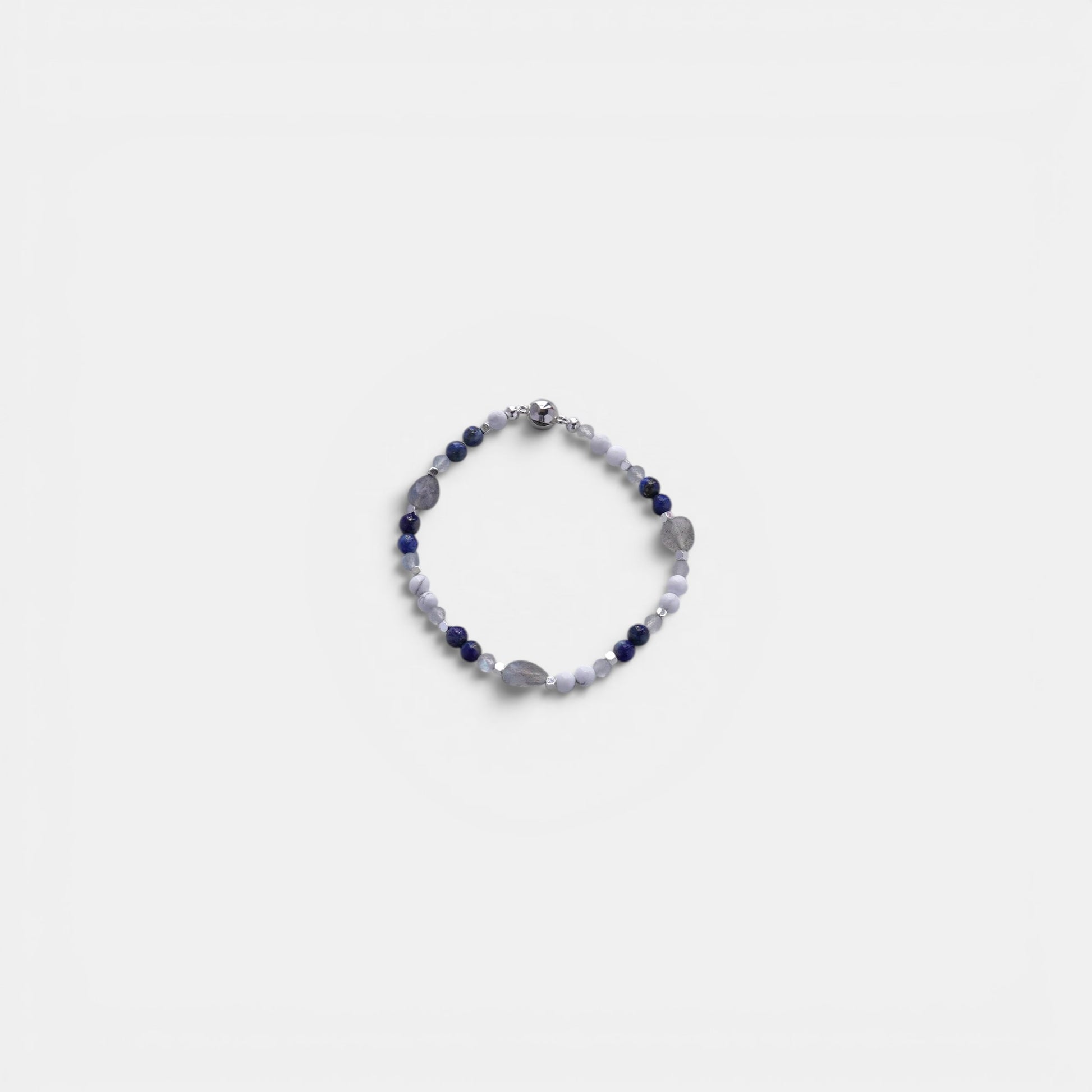 Hollywood Road Stories stretch bracelet featuring blue sodalite, white howlite, and grey moonstone beads with metallic accents.