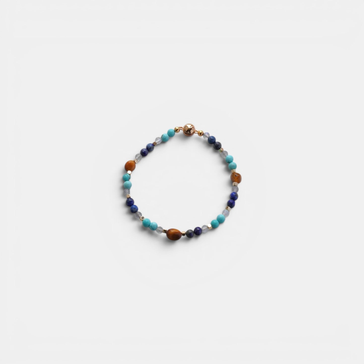 Hollywood Road Stories beaded bracelet with turquoise, lapis lazuli, and tiger's eye gemstones and a gold-tone clasp.
