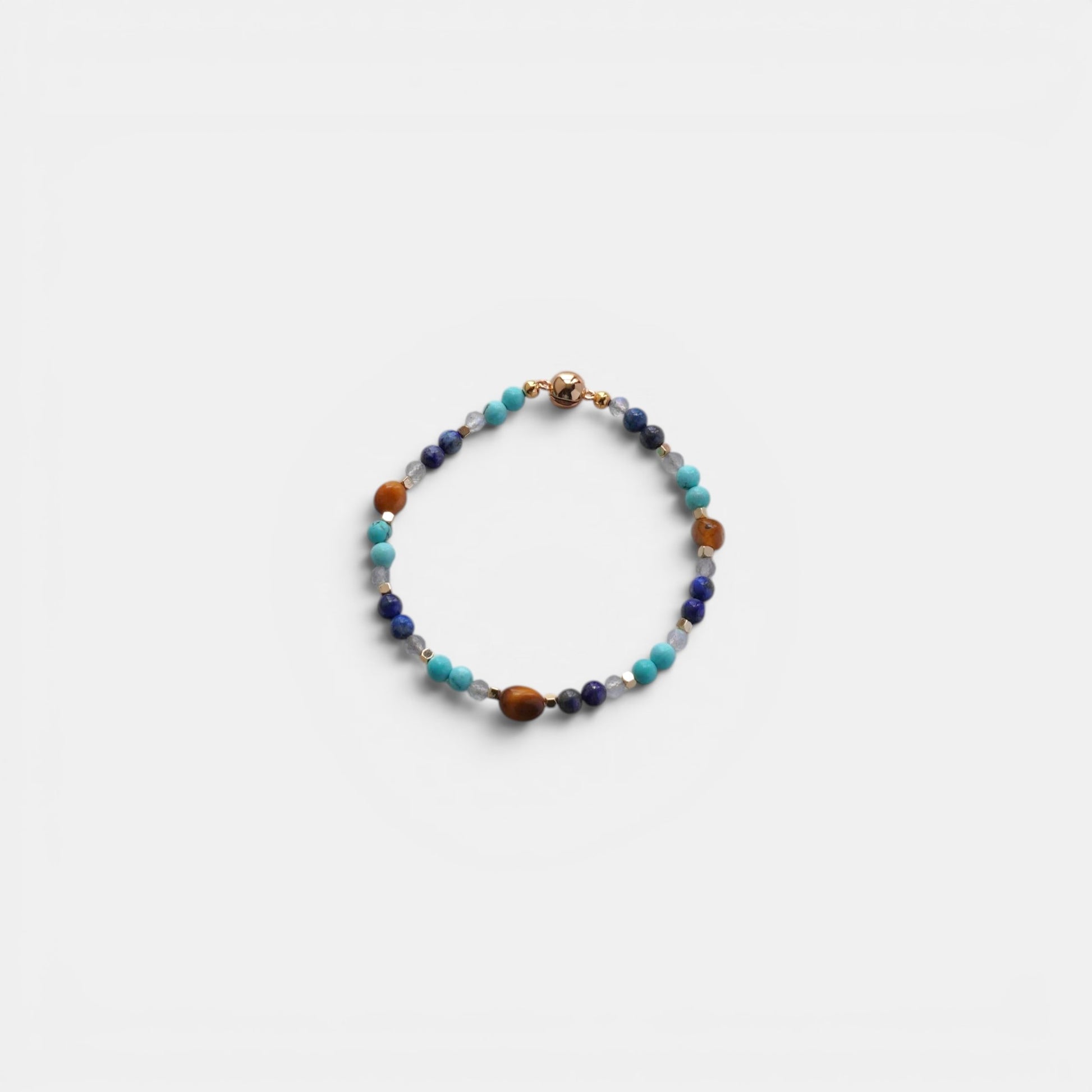 Hollywood Road Stories beaded bracelet with turquoise, lapis lazuli, and tiger's eye gemstones and a gold-tone clasp.