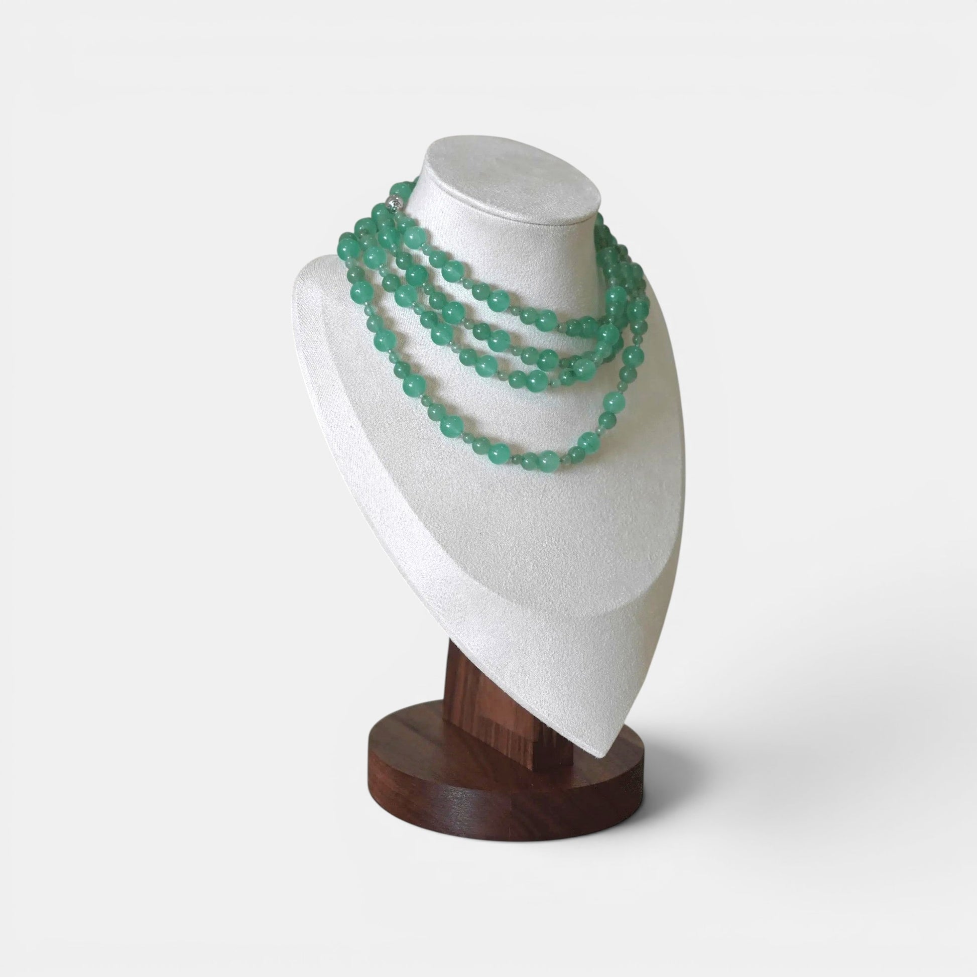 Hollywood Road Stories multi-strand seafoam green aventurine beaded necklace on a white jewelry display bust.
