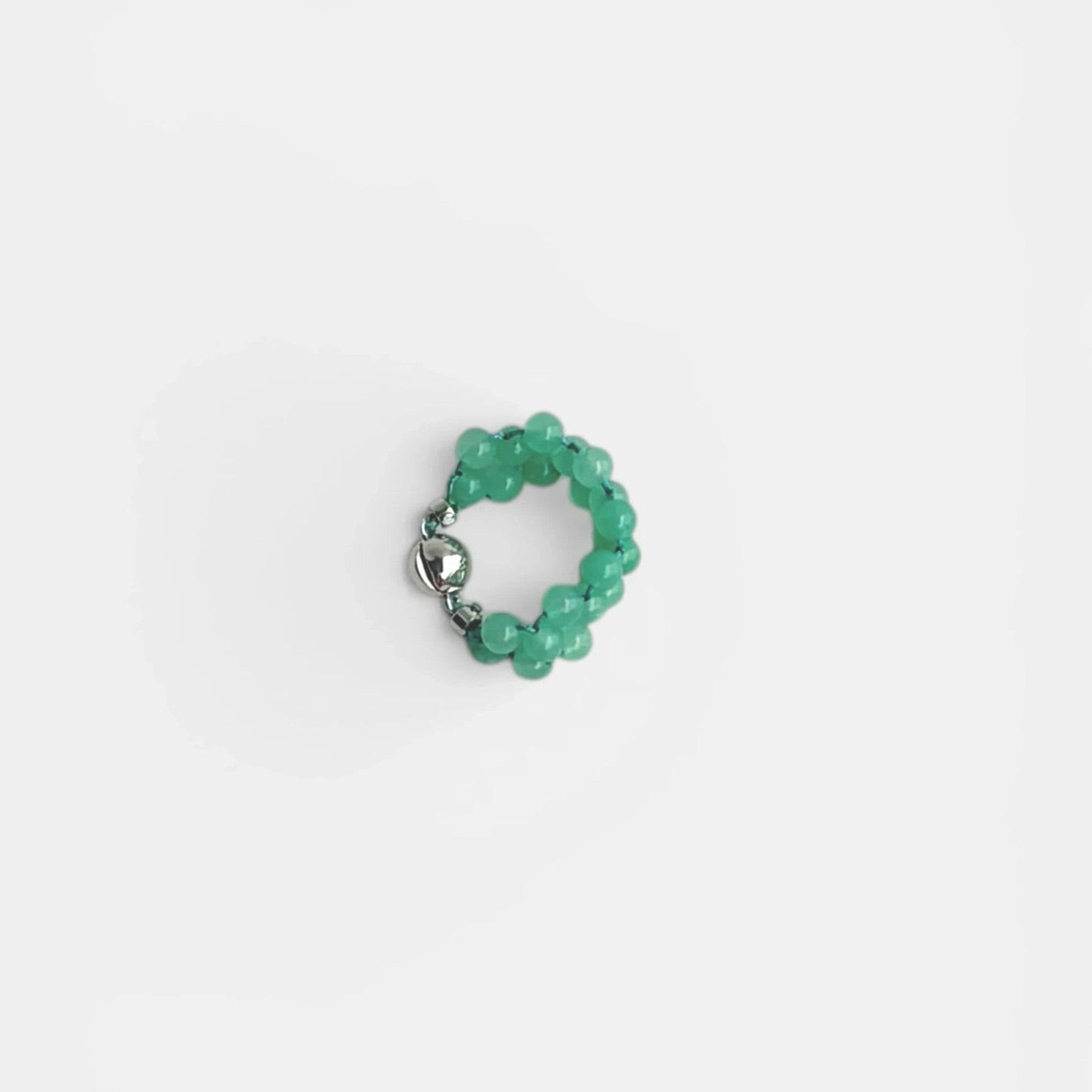 Hollywood Road Stories green beaded statement ring with a polished silver-tone clasp on a white background.