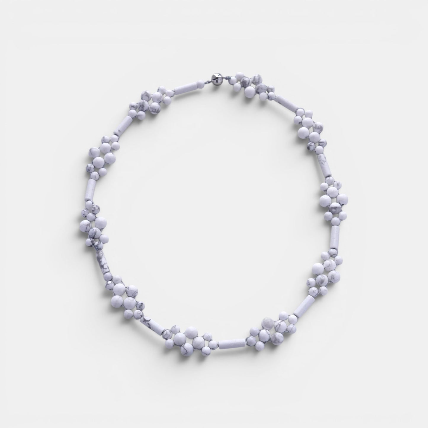 Hollywood Road Stories handcrafted white howlite beaded statement necklace with flower-inspired stone clusters.