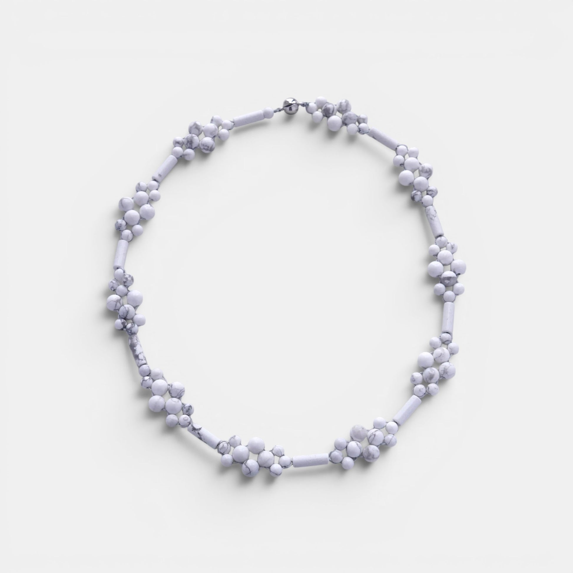 Hollywood Road Stories handcrafted white howlite beaded statement necklace with flower-inspired stone clusters.