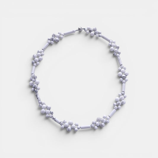 Hollywood Road Stories handcrafted white howlite beaded statement necklace with flower-inspired stone clusters.