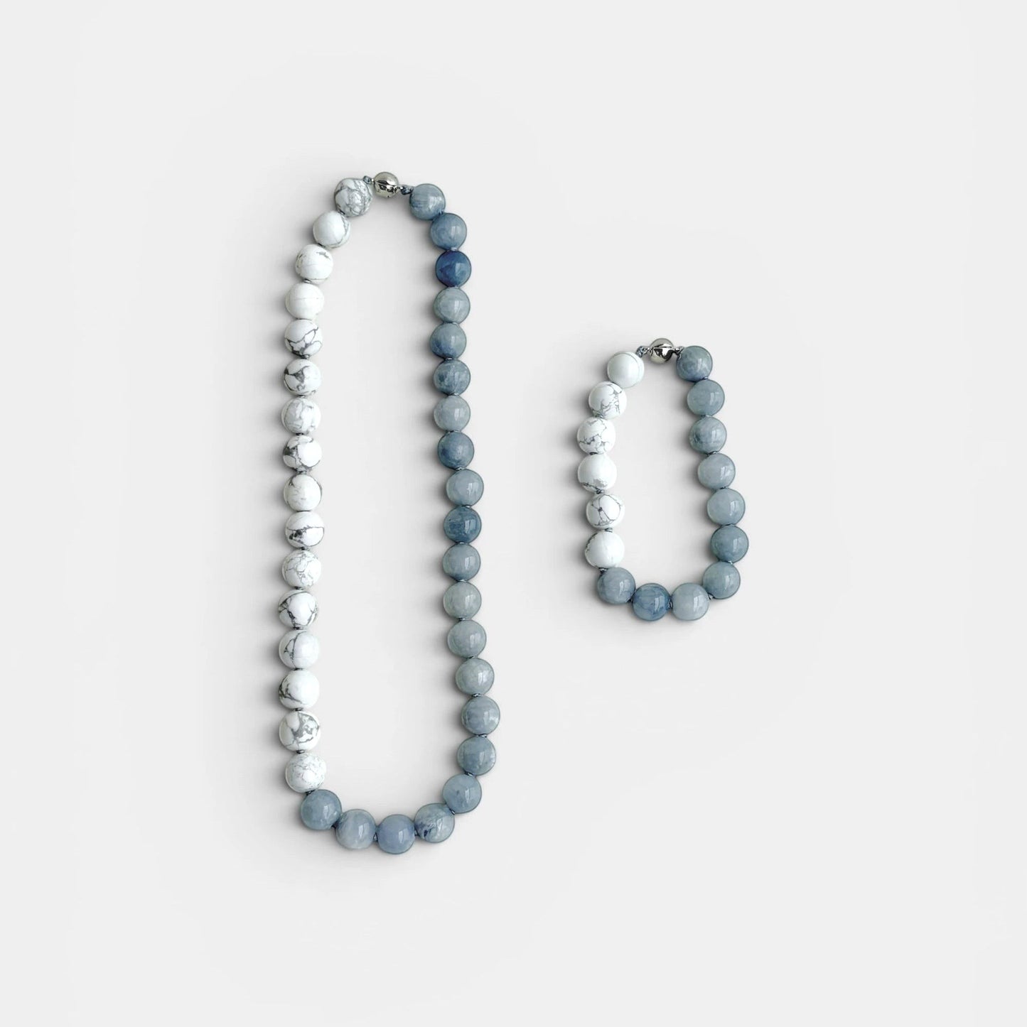 Hollywood Road Stories beaded necklace and bracelet set featuring white howlite and slate blue chalcedony stones.