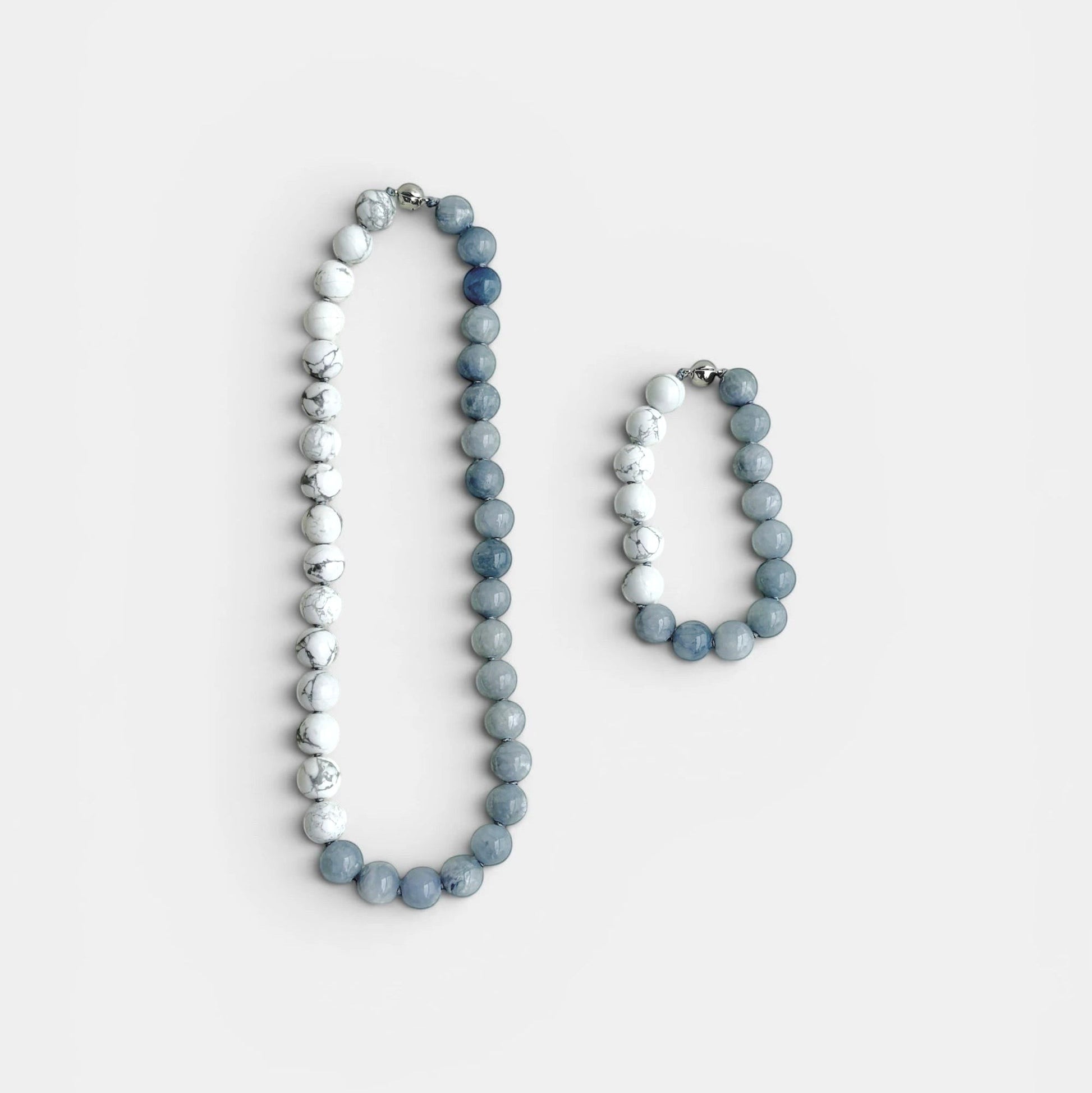 Hollywood Road Stories beaded necklace and bracelet set featuring white howlite and slate blue chalcedony stones.