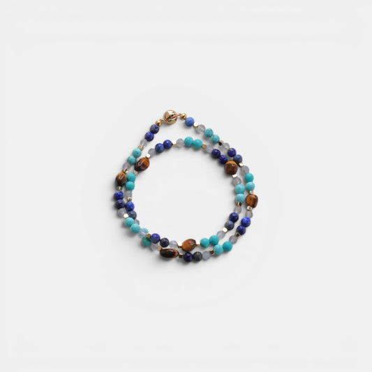 Hollywood Road Stories multi-strand gemstone wrap bracelet with lapis lazuli, turquoise, tiger's eye, and gold spacers.