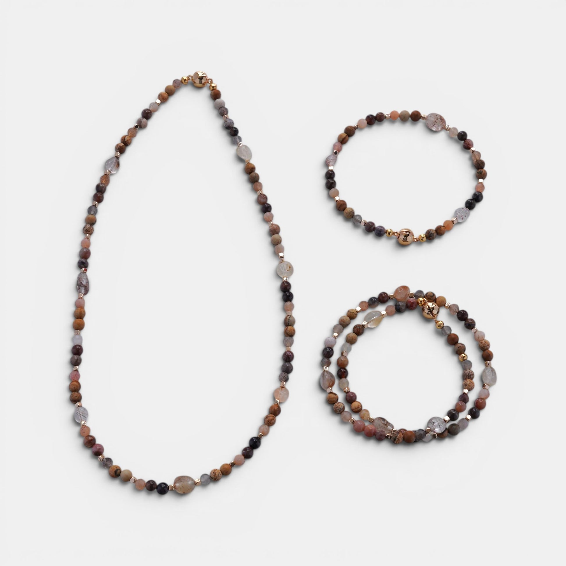 Hollywood Road Stories multi-strand necklace and matching bracelets with terracotta, grey, and cream natural stone beads