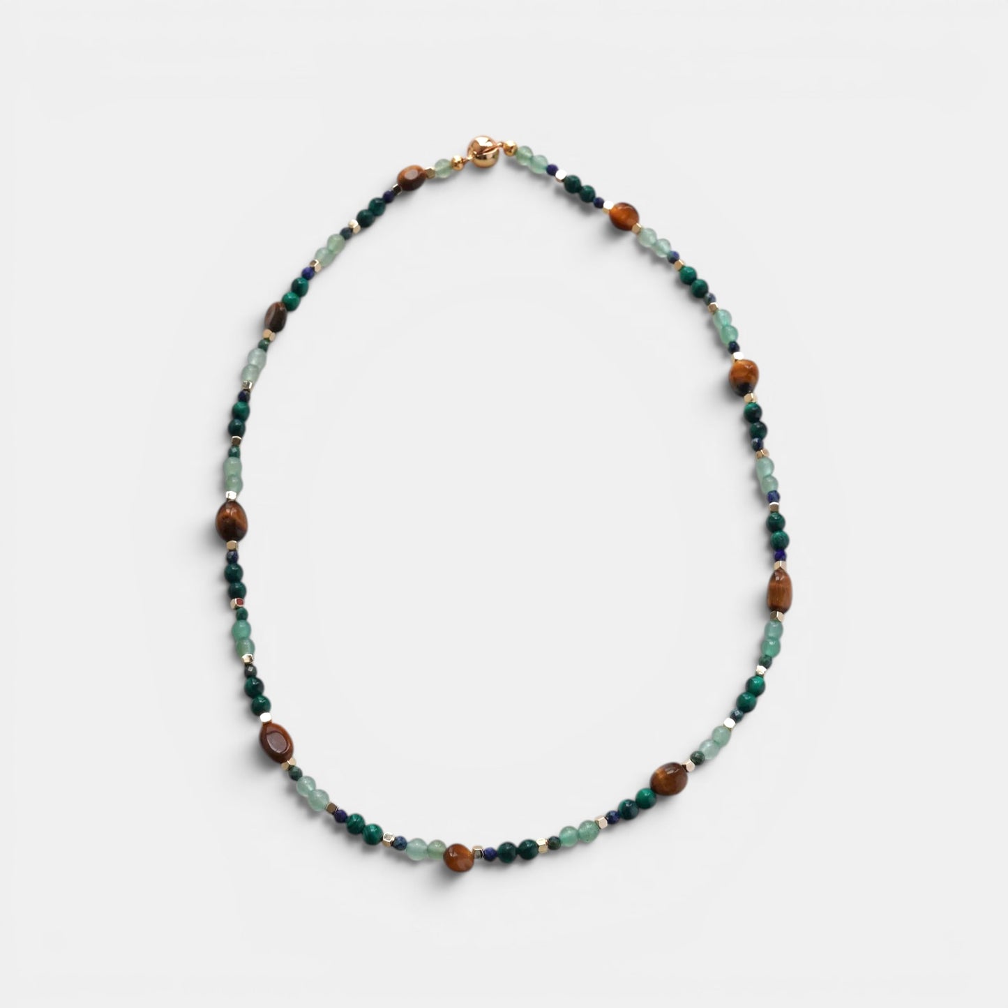 Hollywood Road Stories multi-stone beaded necklace featuring tiger's eye, malachite, and aventurine with gold clasp.