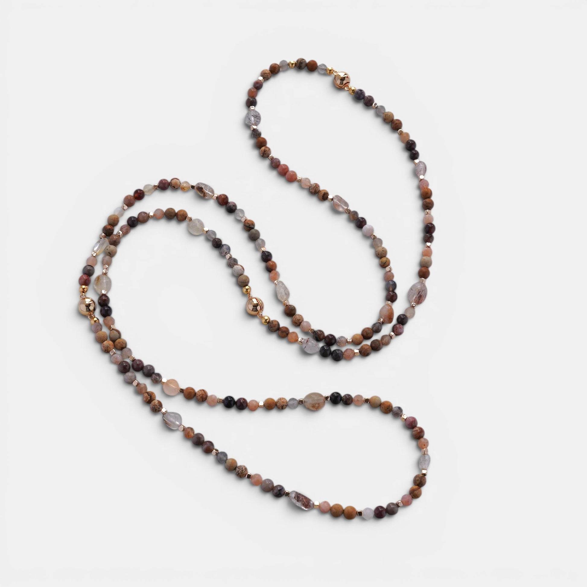 Hollywood Road Stories multi-strand beaded necklace with terracotta, grey, and cream natural stones and gold accents.