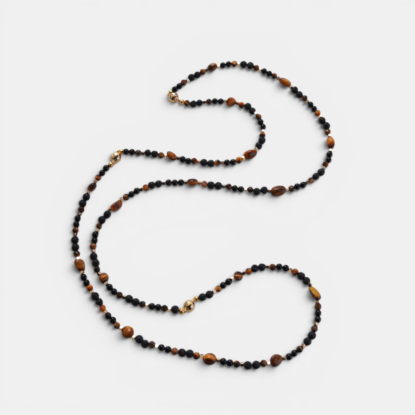 Hollywood Road Stories beaded layering necklace featuring black onyx and tiger eye stones with gold metallic accents.