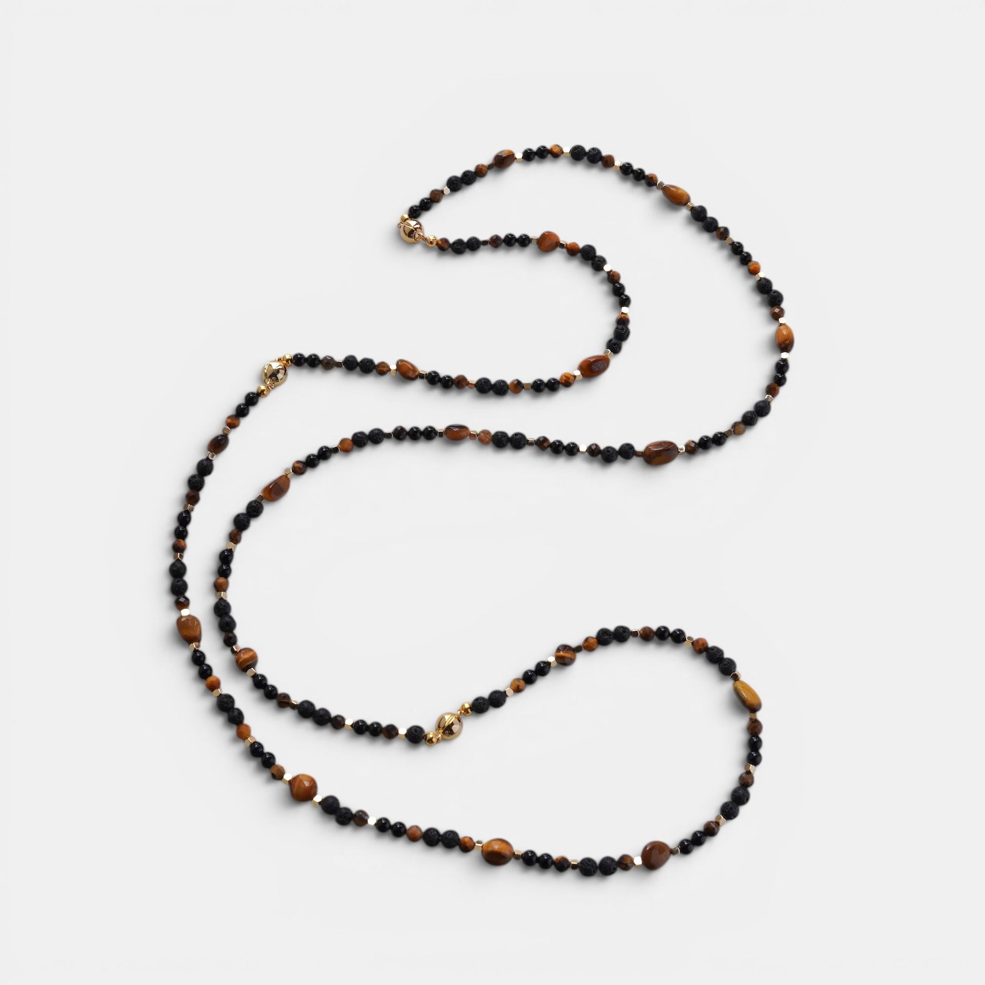 Hollywood Road Stories beaded layering necklace featuring black onyx and tiger eye stones with gold metallic accents.