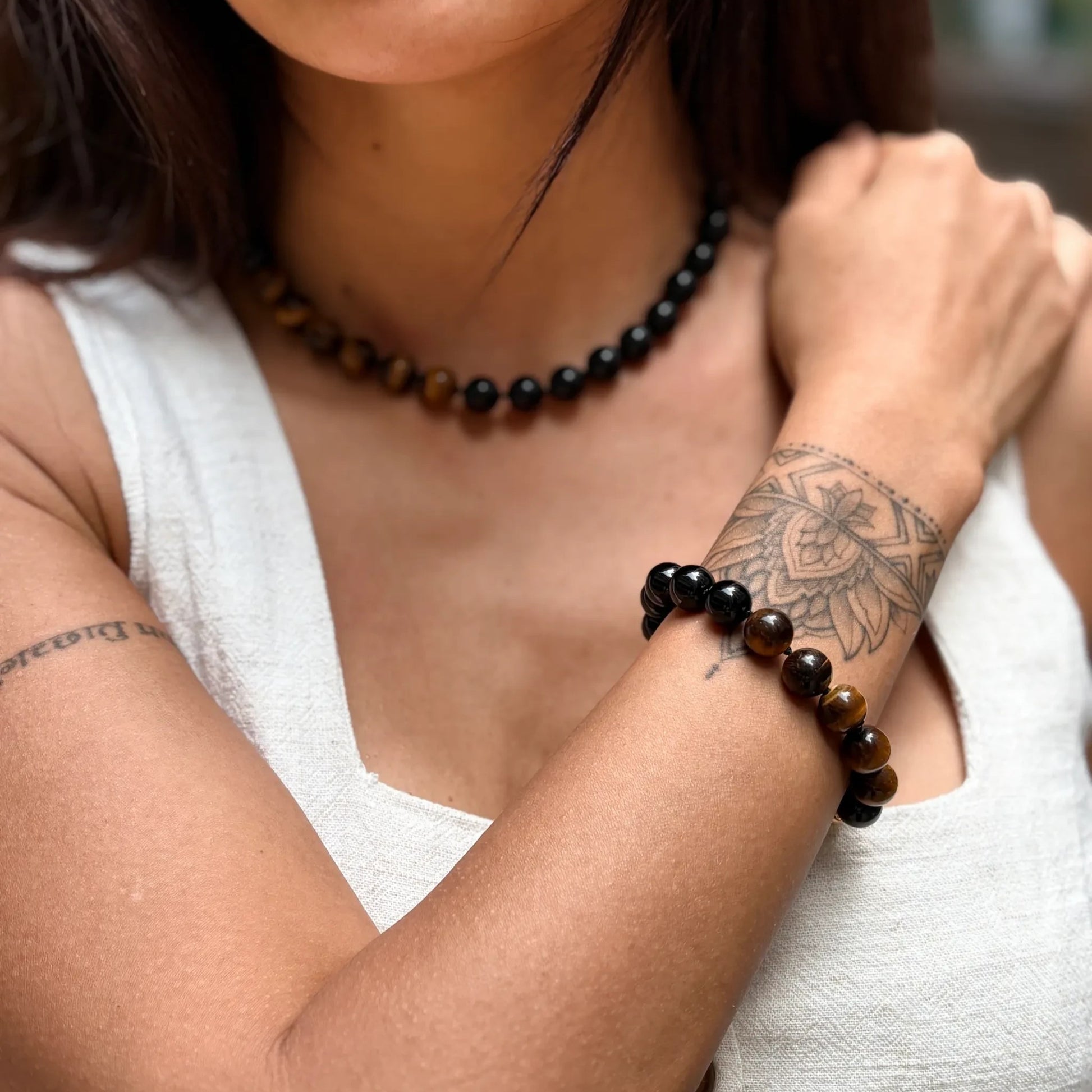 Hollywood Road Stories Bonham choker necklace and matching bracelet featuring black onyx and tiger's eye gemstones.