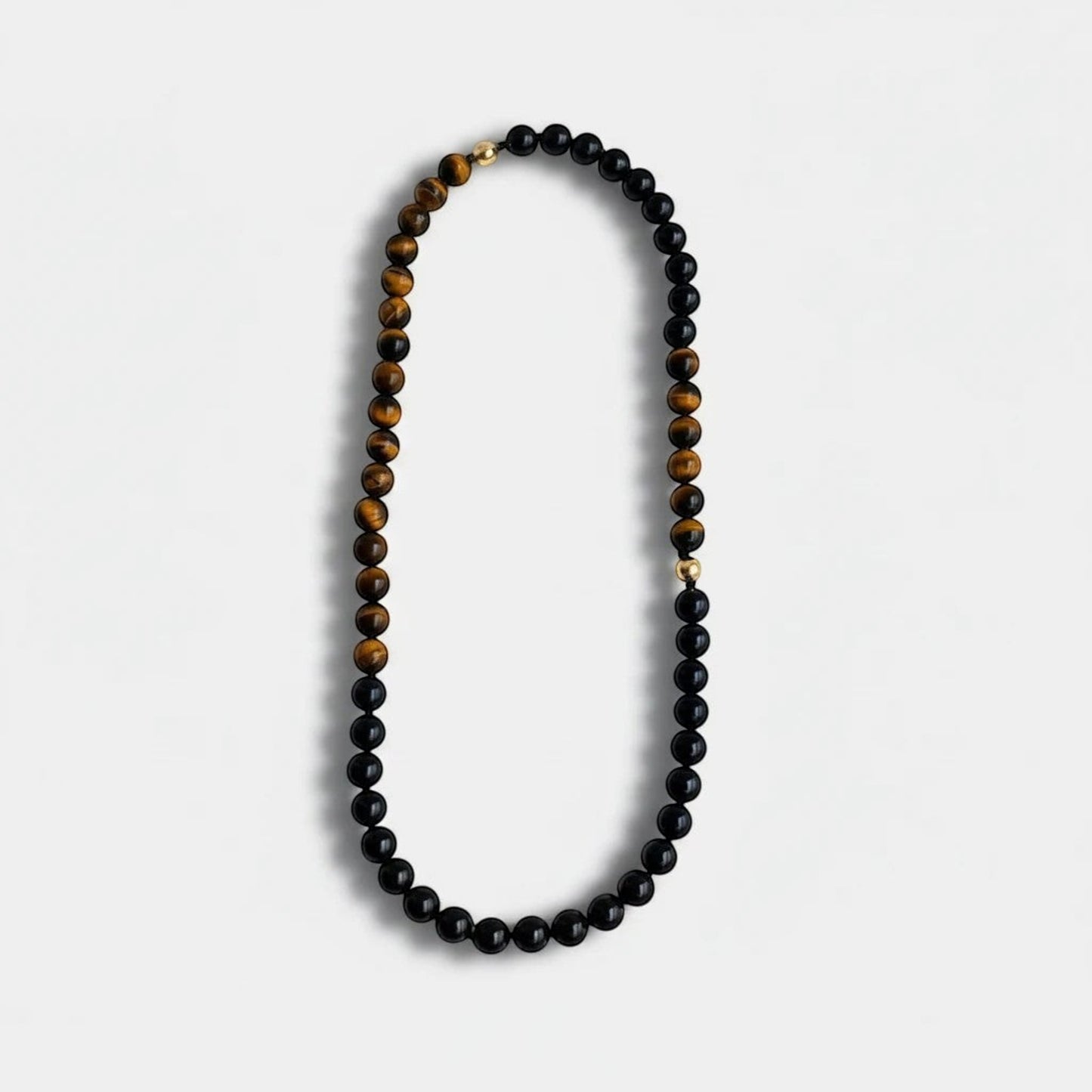 Hollywood Road Stories Bonham beaded necklace featuring black onyx and tiger's eye gemstones with a 14K gold clasp.