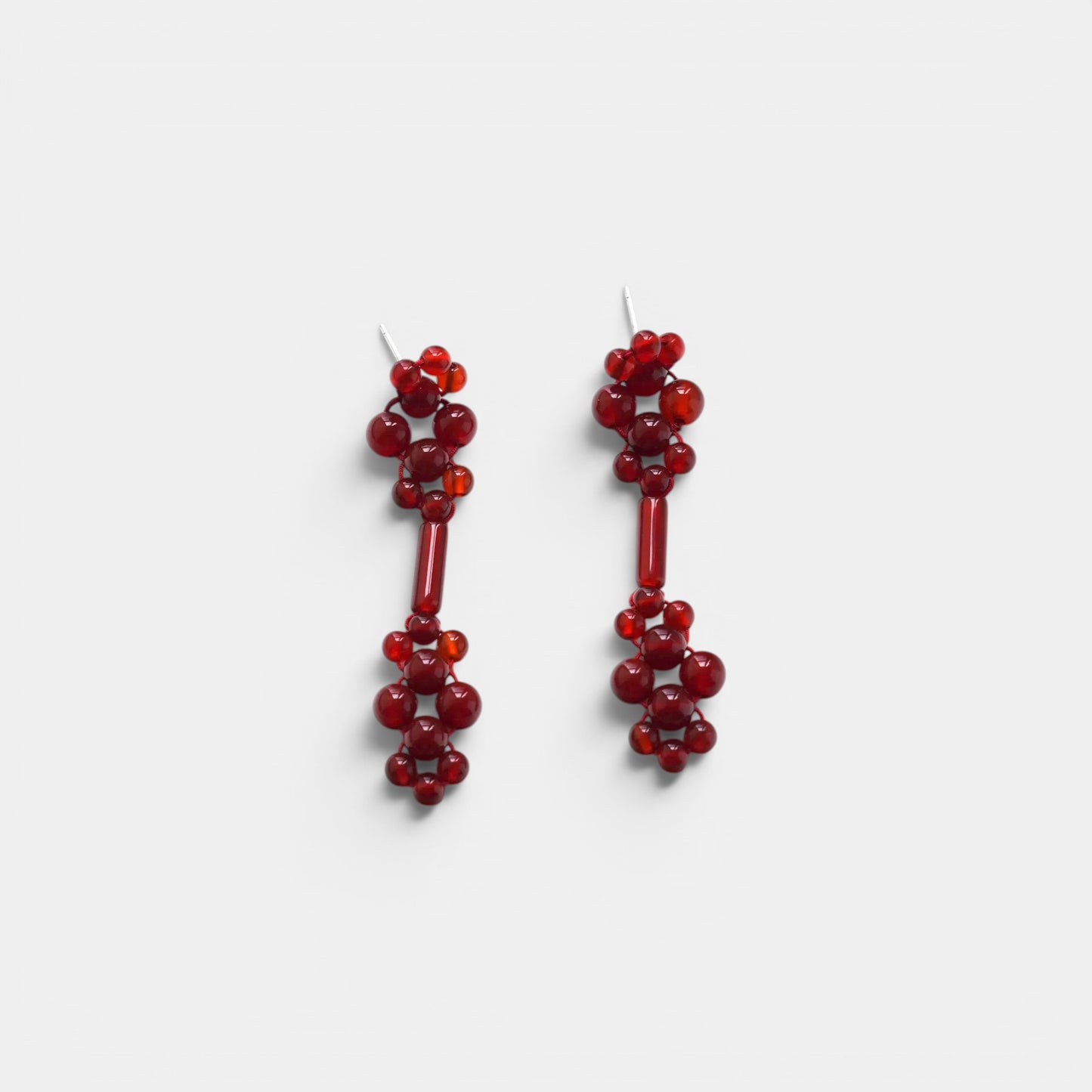 Hollywood Road Stories handcrafted red beaded drop earrings with a cluster design and elongated central bar.