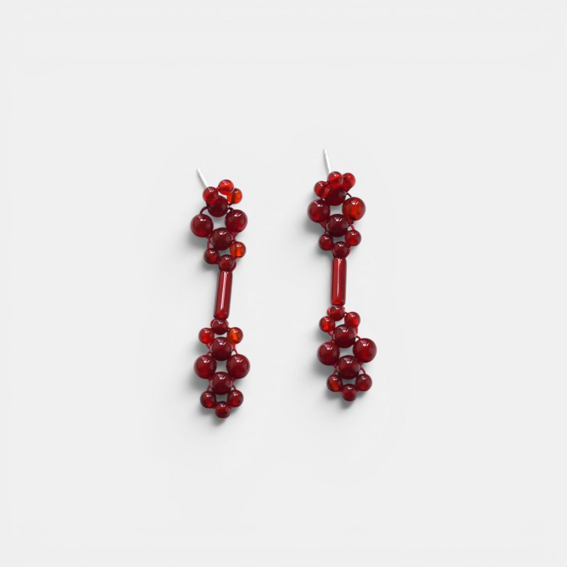 Hollywood Road Stories handcrafted red beaded drop earrings with a cluster design and elongated central bar.