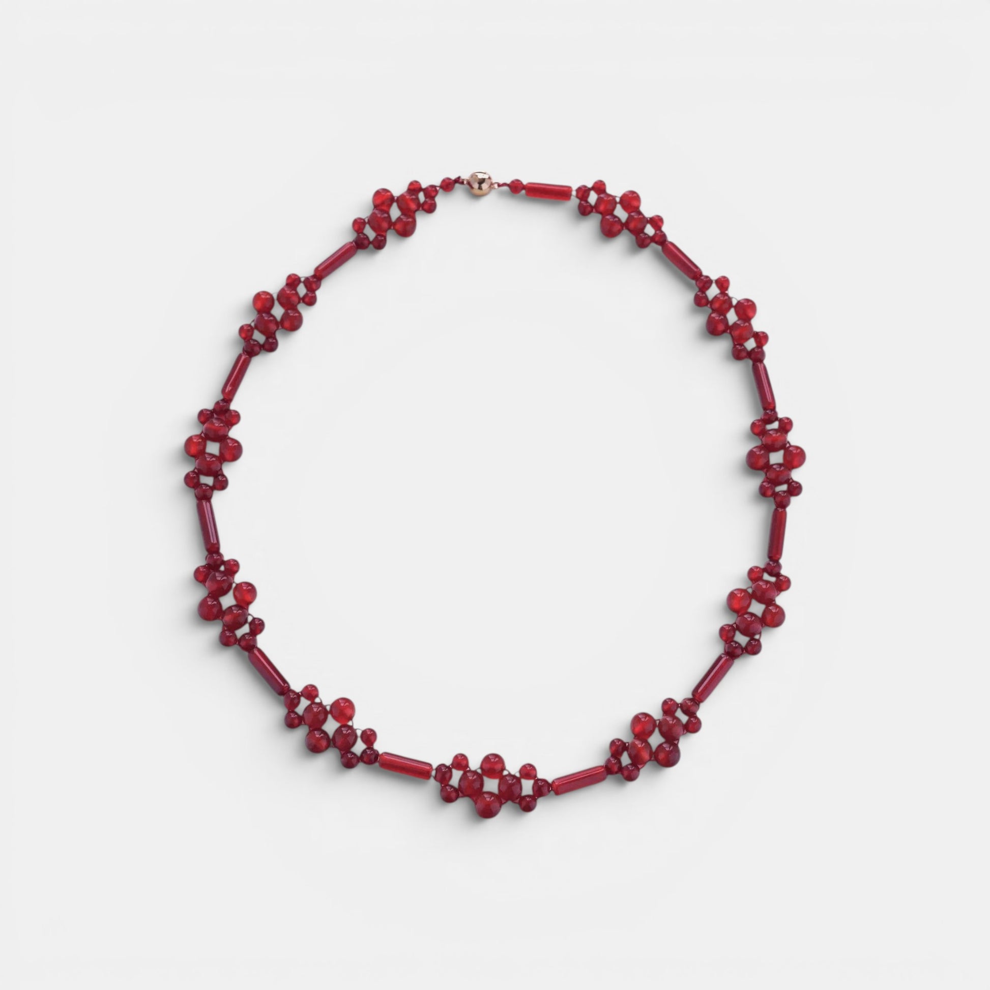 Hollywood Road Stories handcrafted red beaded statement necklace with floral-inspired clusters and gold-tone clasp.