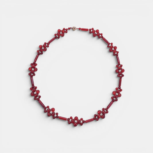 Hollywood Road Stories handcrafted red beaded statement necklace with floral-inspired clusters and gold-tone clasp.
