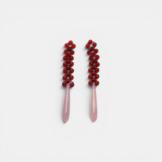 Hollywood Road Stories beaded drop earrings with deep red glass bead tops and smooth pale pink teardrop pendants.