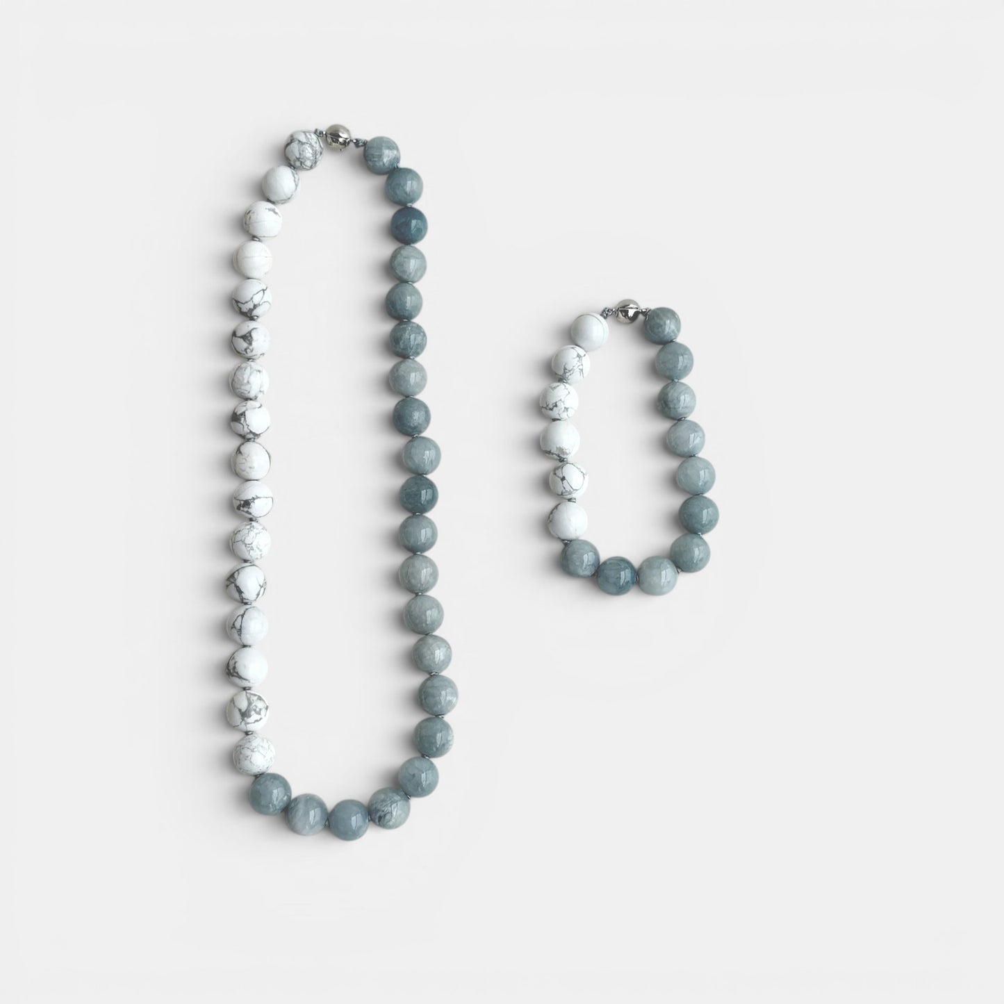 Hollywood Road Stories natural stone beaded necklace and stretch bracelet set in marbled white and cool grey tones.