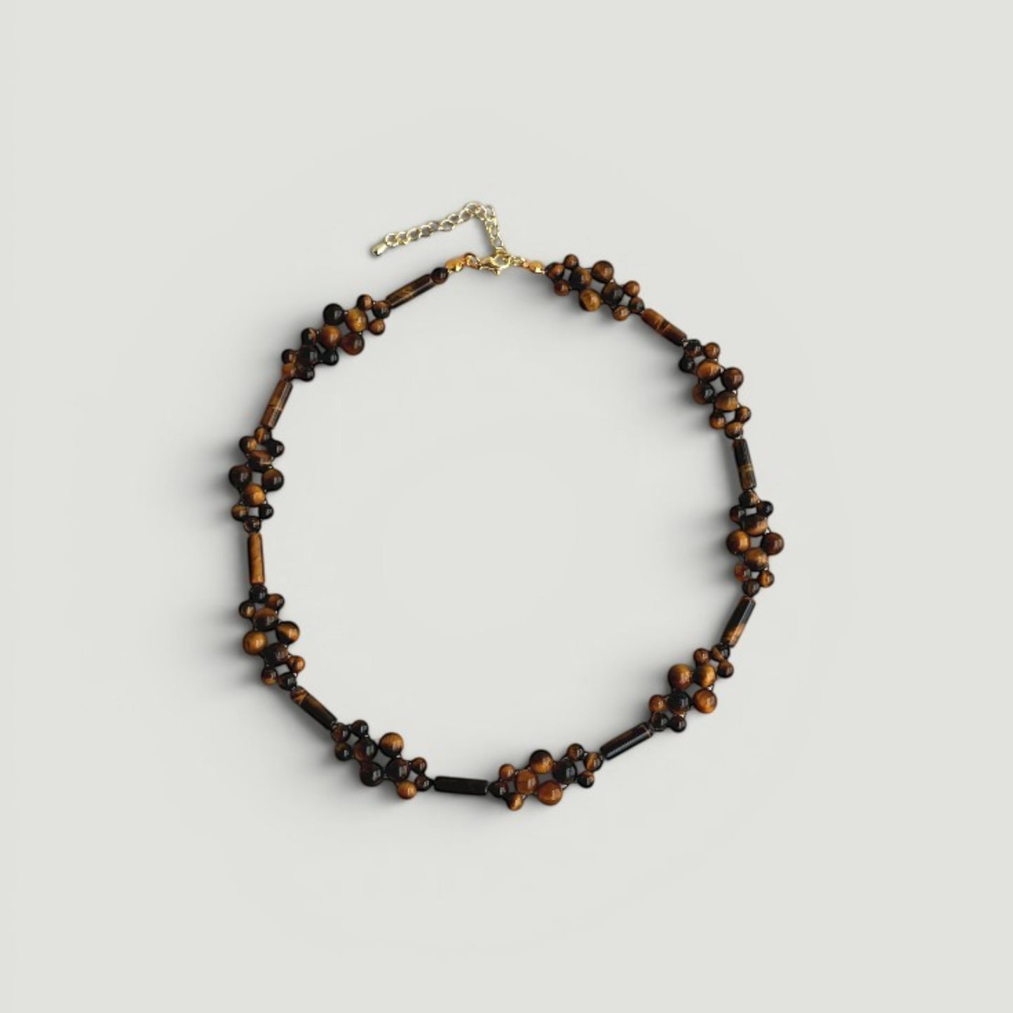 Hollywood Road Stories handcrafted tiger's eye beaded choker necklace with round and elongated stone accents.