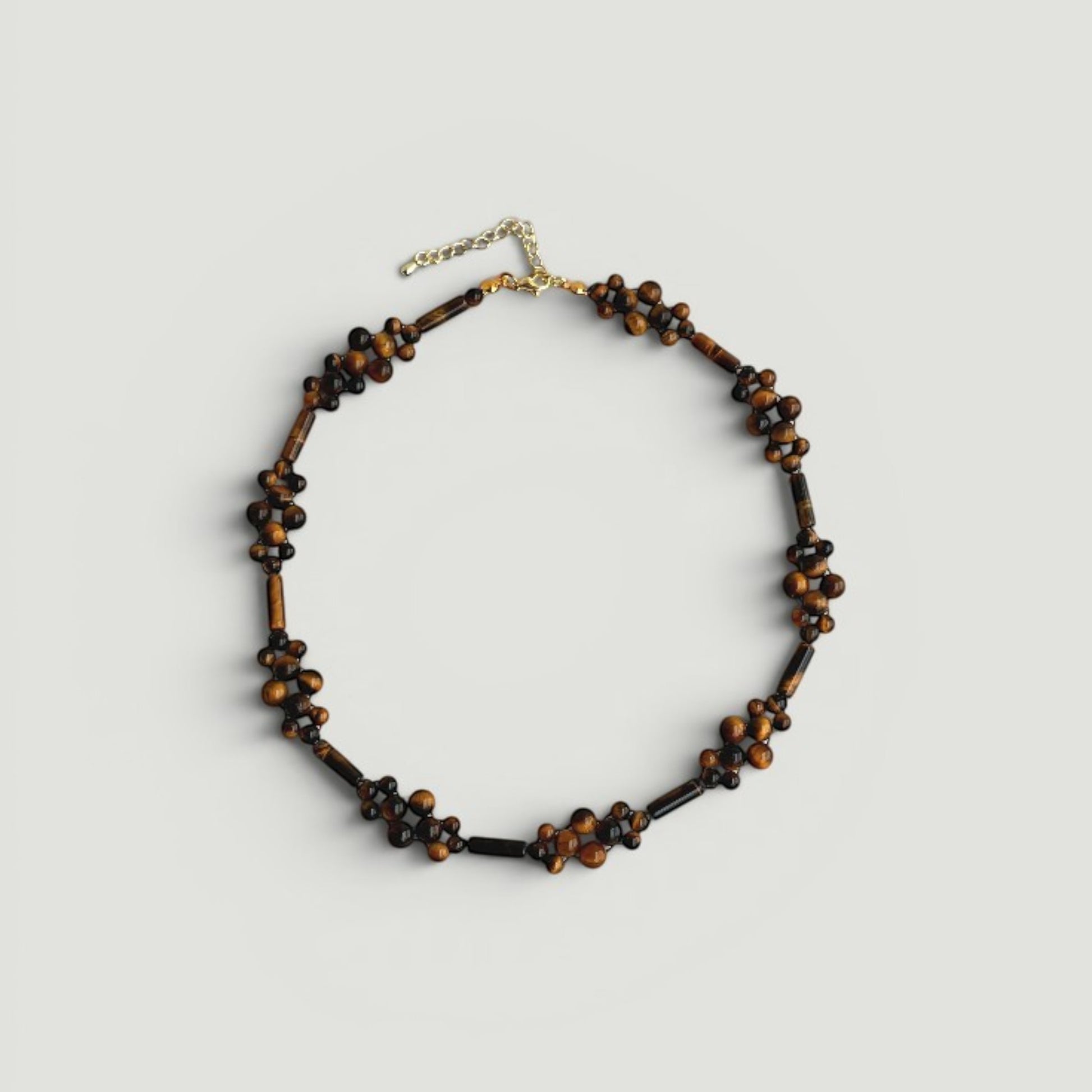 Hollywood Road Stories handcrafted tiger's eye beaded choker necklace with round and elongated stone accents.