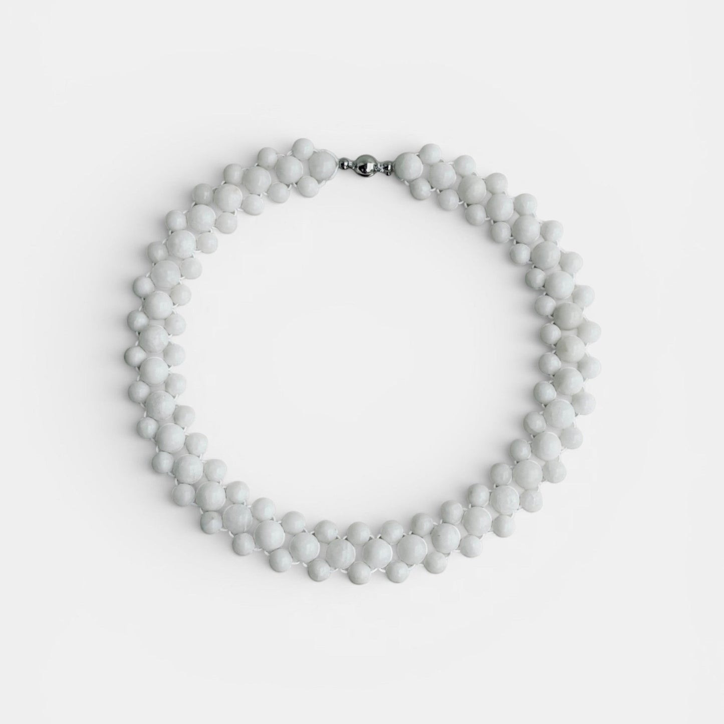 Hollywood Road Stories multi-strand white beaded statement necklace with a polished silver-tone clasp.