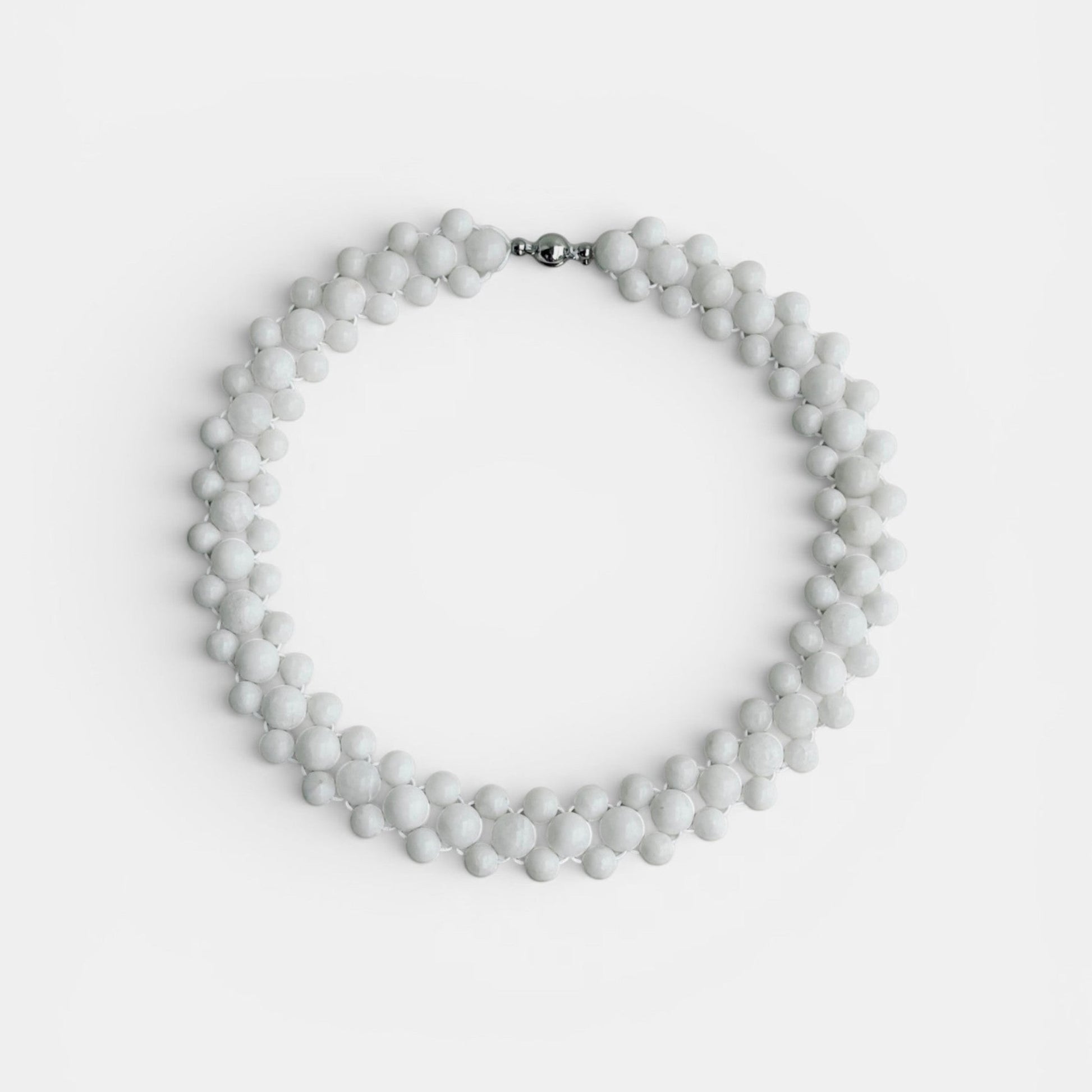 Hollywood Road Stories multi-strand white beaded statement necklace with a polished silver-tone clasp.