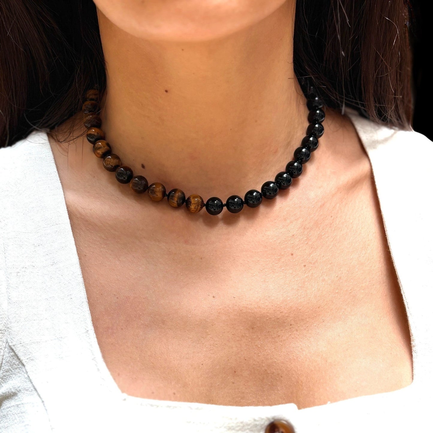 statement gemstone necklace on model in Hong Kong summer